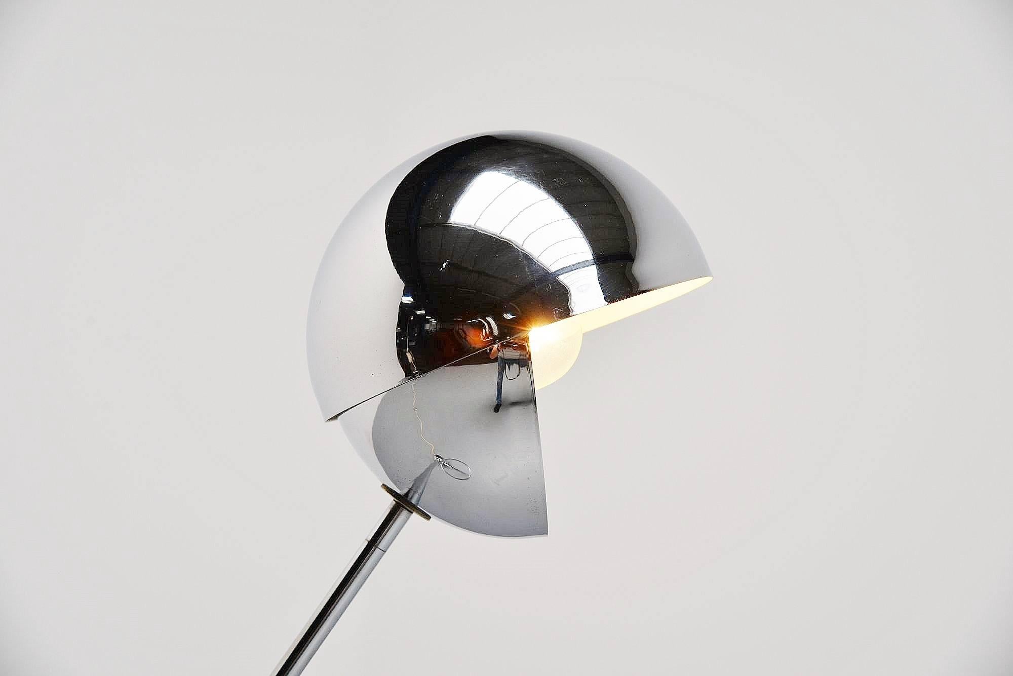 Adjustable floor lamp mode S3 designed by Paolo Tilche for Sirrah, Italy, 1972. This floor lamp has a round counter weight that creates perfect balance to adjust it. The shade swivels and creates a very nice spherical light when changed in different