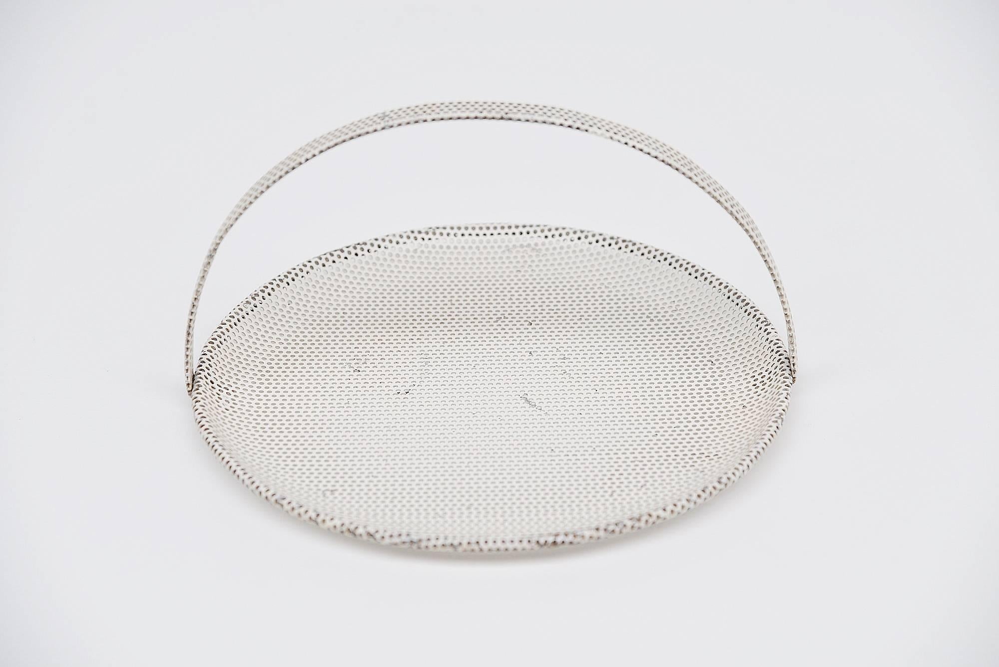 Small subtle fruit bowl designed by Mathieu Mategot, made in the Mategote Atelier in France, 1950. This small tray has a very nice quality die cut dot pattern all-over which was Mategots trade mark. The tray has its original white color and this has