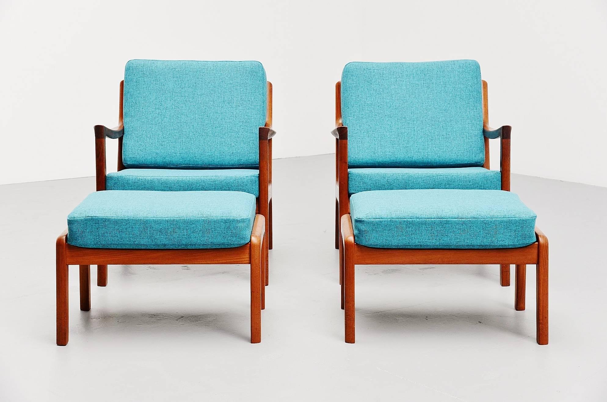 Very nice early production easy chairs set and ottomans of the Senator series designed by Ole Wanscher, produced by France & Son, Denmark 1951. Later on produced by Cado. Very nice pair of easy chairs in solid teakwood, newly upholstered in bright
