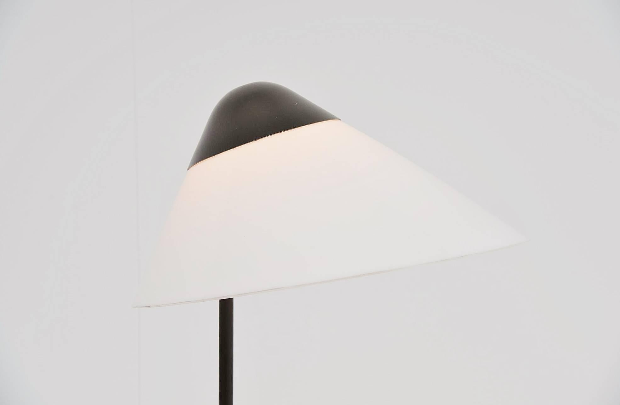 Very nice table lamp designed by Hans J. Wegner for Louis Poulsen, Denmark 1975. This table lamp has a grey or brown lacquer finish and a white plexiglass shade. This lamp gives very nice diffused light when lit. This is an original early edition in