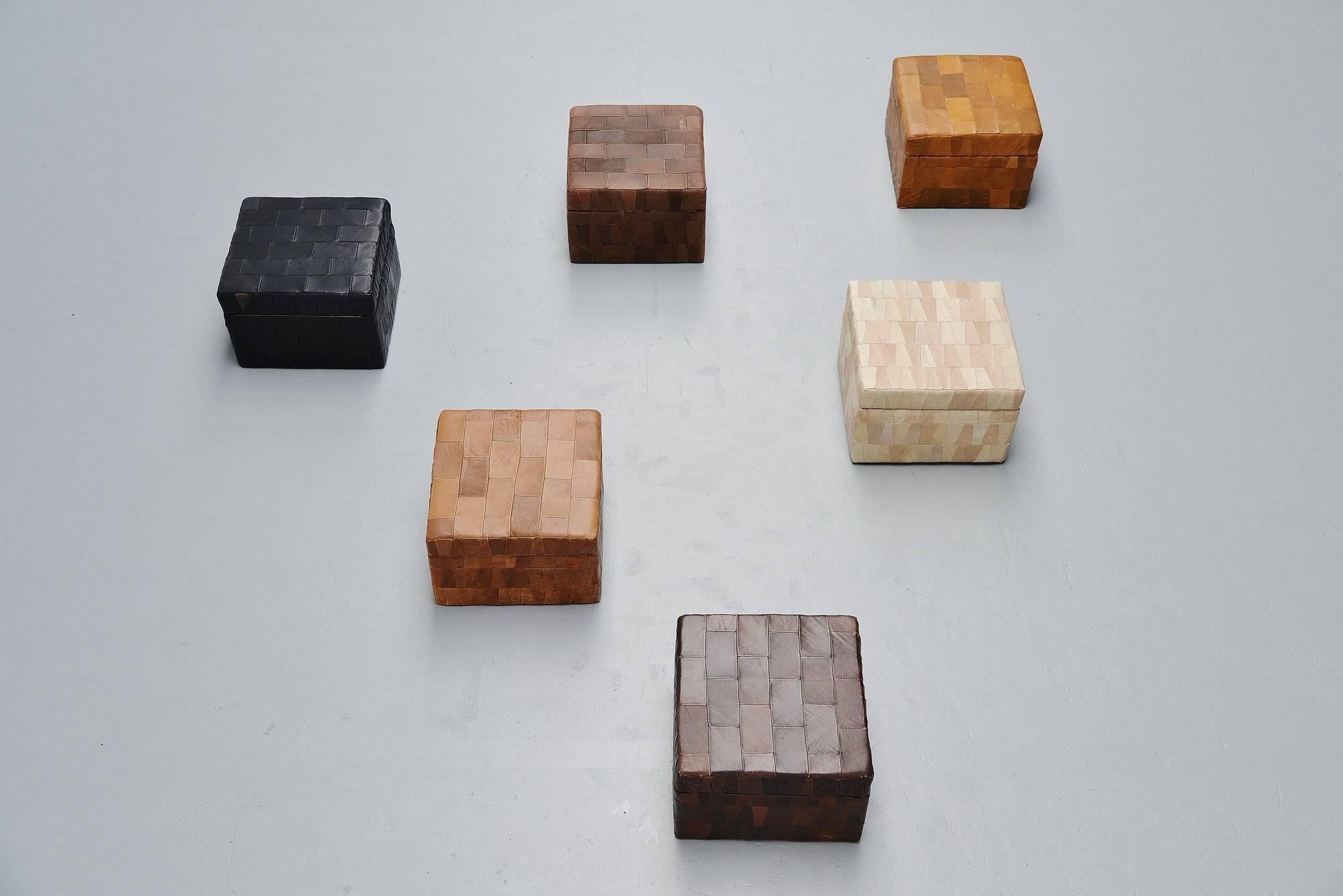 Very nice group of six storage poofs model DS-9087 designed and made by De Sede, Switzerland, 1970. The patchwork series were created in the 1970s as De Sede had a lot of parts left from their leather sofa's. Someone had the idea to use these