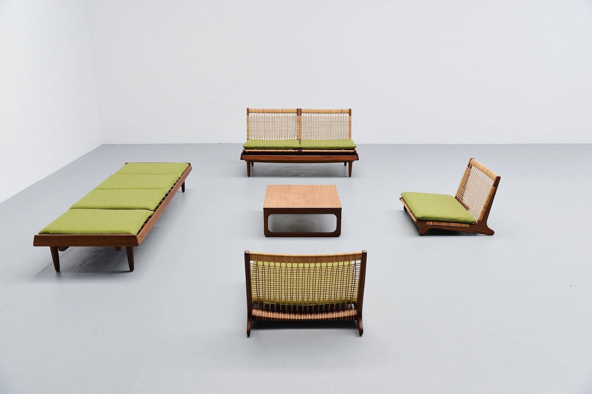 Fantastic seating group model TV161 designed by Hans Olsen, manufactured by Bramin, Denmark 1957. This set is made of solid teak, with very nice cane work and green (Divina by Kvadrat) upholstered cushions. This set is very multi functional. Can be