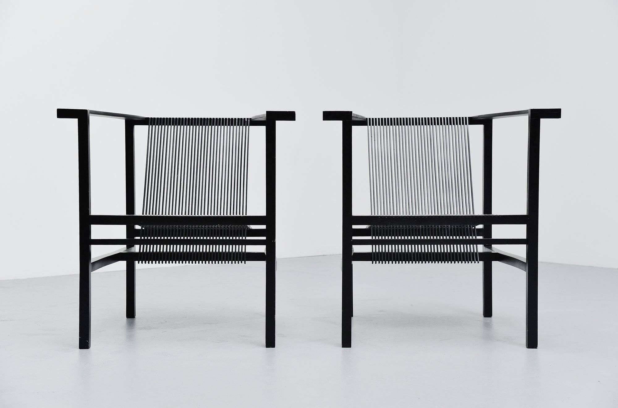 Pair of rare high slat armchairs designed by Ruud Jan Kokke, produced by Metaform 1984. These chairs were produced by Metaform for 17 years, and only on request because the production was too costly. This is for a very nice pair of black lacquered