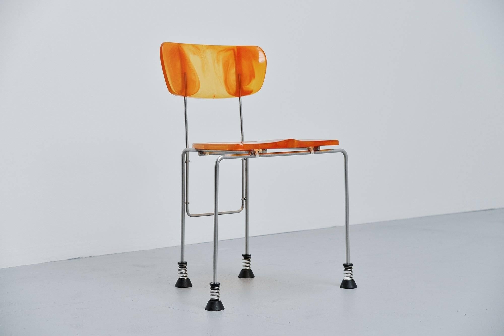 Sculptural 'Broadway' side chair designed by Gaetano Pesce and manufactured by Bernini, Italy, 1993. The chair is made of orange resin molded plastic. And has 4 brushed steel legs with spring feet. The chair is in good condition and marked with the