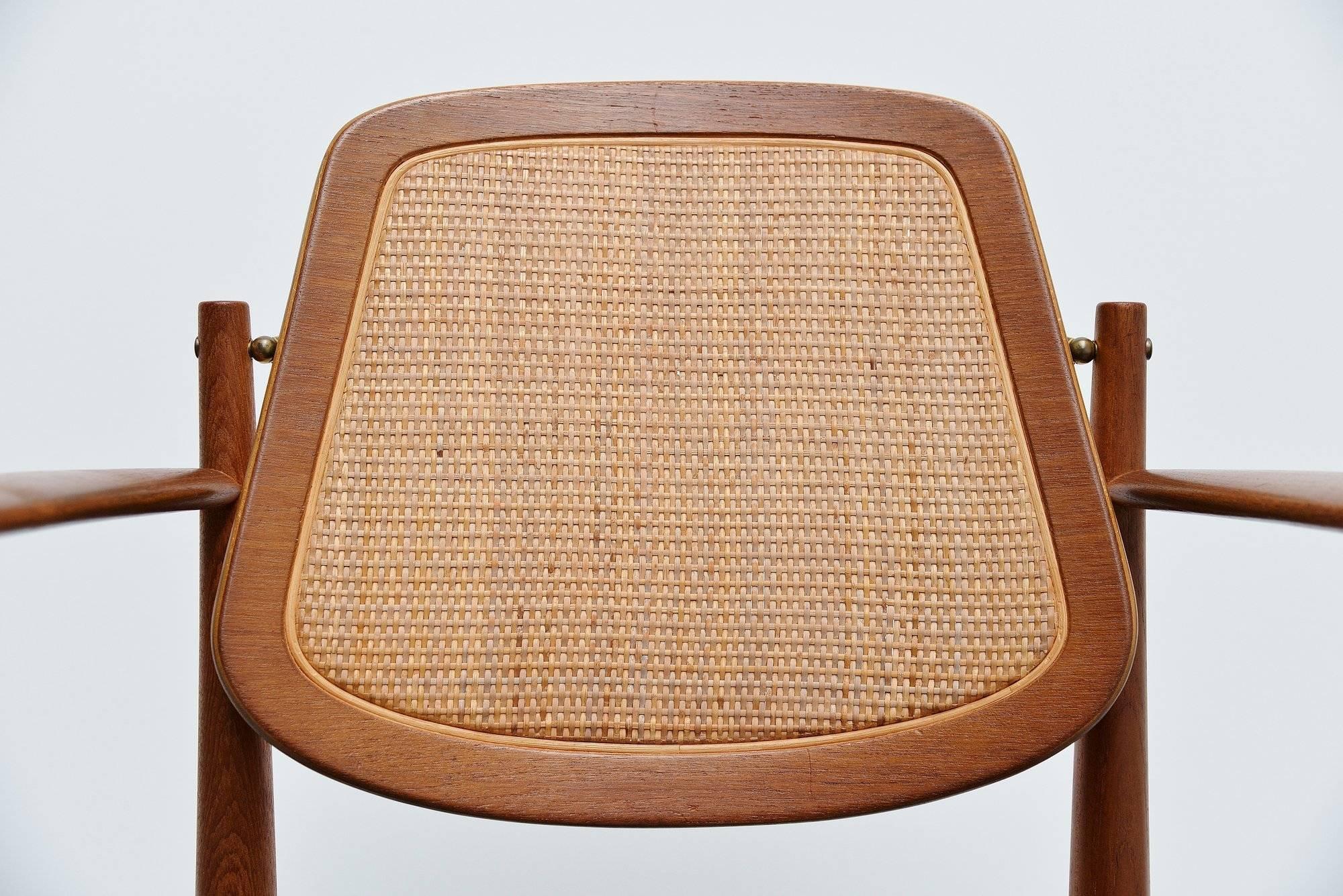 Sophisticated armchair model FD186 designed by Arne Vodder and manufactured by France & Son, Denmark 1956. The armchair has a teak wooden frame, a nice canework inlay back, brass details and black leather upholstery. The chair is in excellent