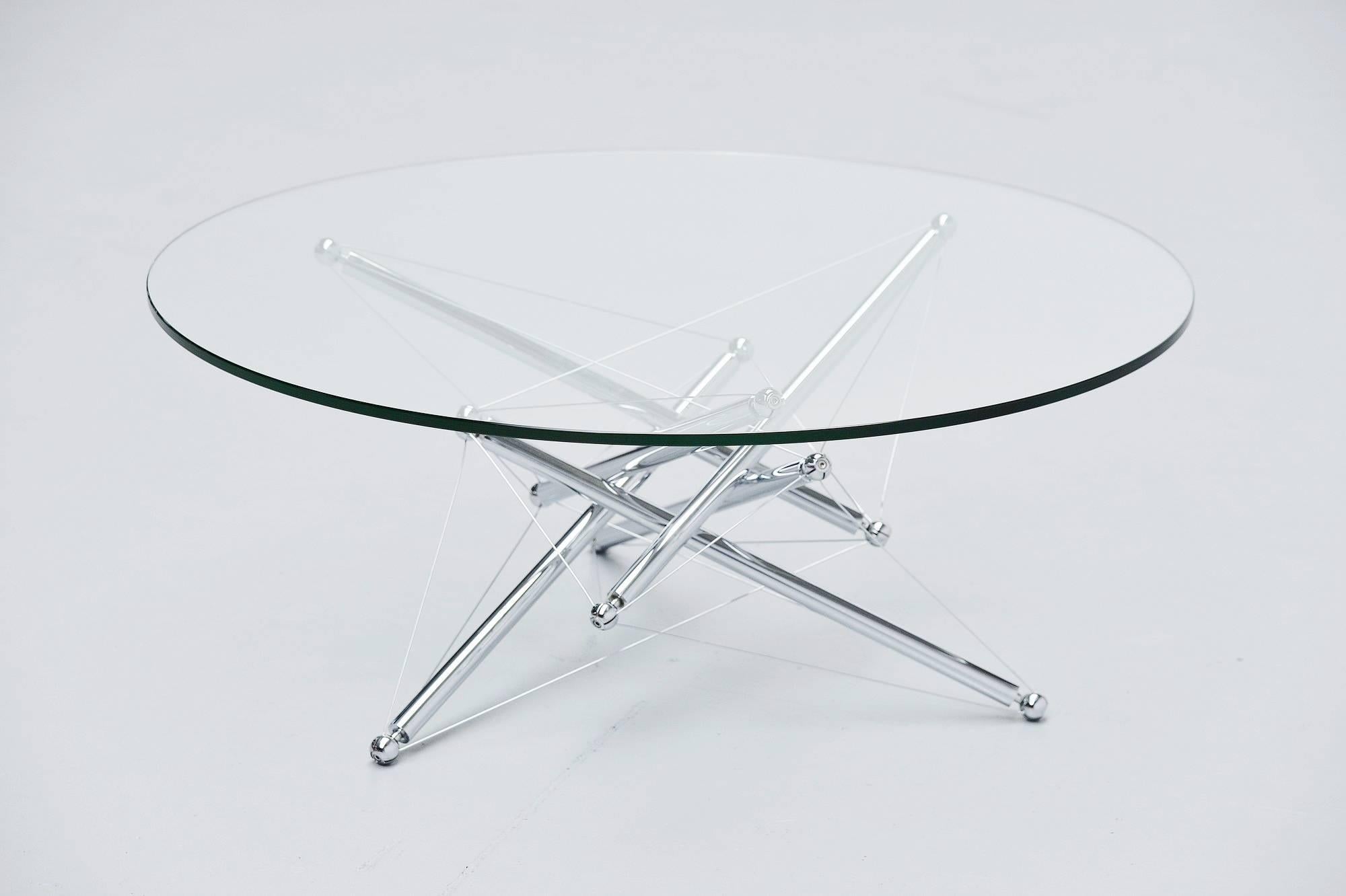 Sculptural coffee table model 713 designed by Theodore Waddell and manufactured by Cassina, Italy, 1973. The coffee table has a very nice sculptural base with chrome metal tubes connected with metal wires. By turning the tubes you can adjust the