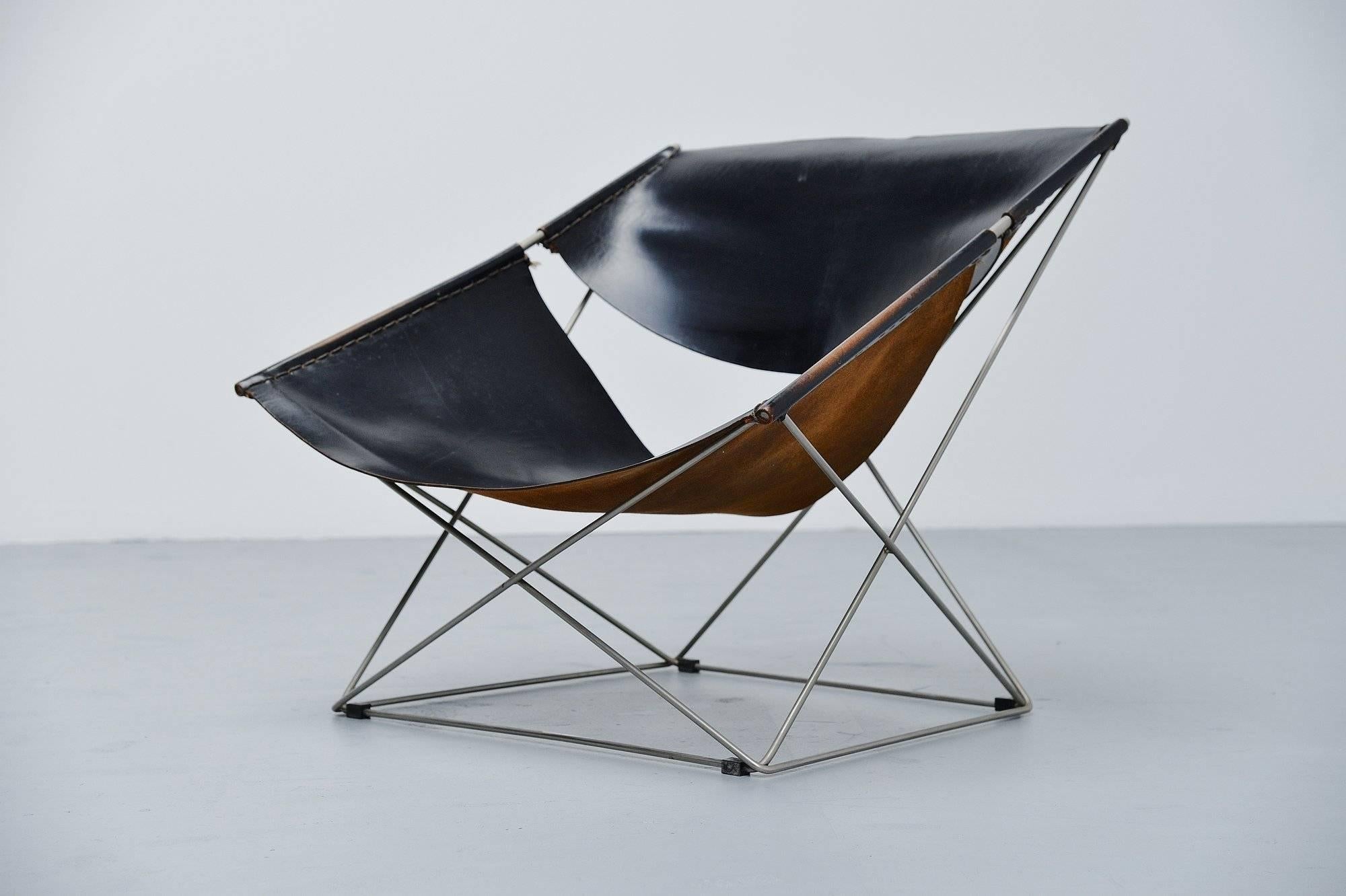 Iconic so called 'butterfly' chair model F675 designed by Pierre Paulin and manufactured by Artifort, Holland, 1963. This is one of the nicest 'light weighted' lounge chairs that Paulin designed. The chair has a nickel plated solid steel frame and a