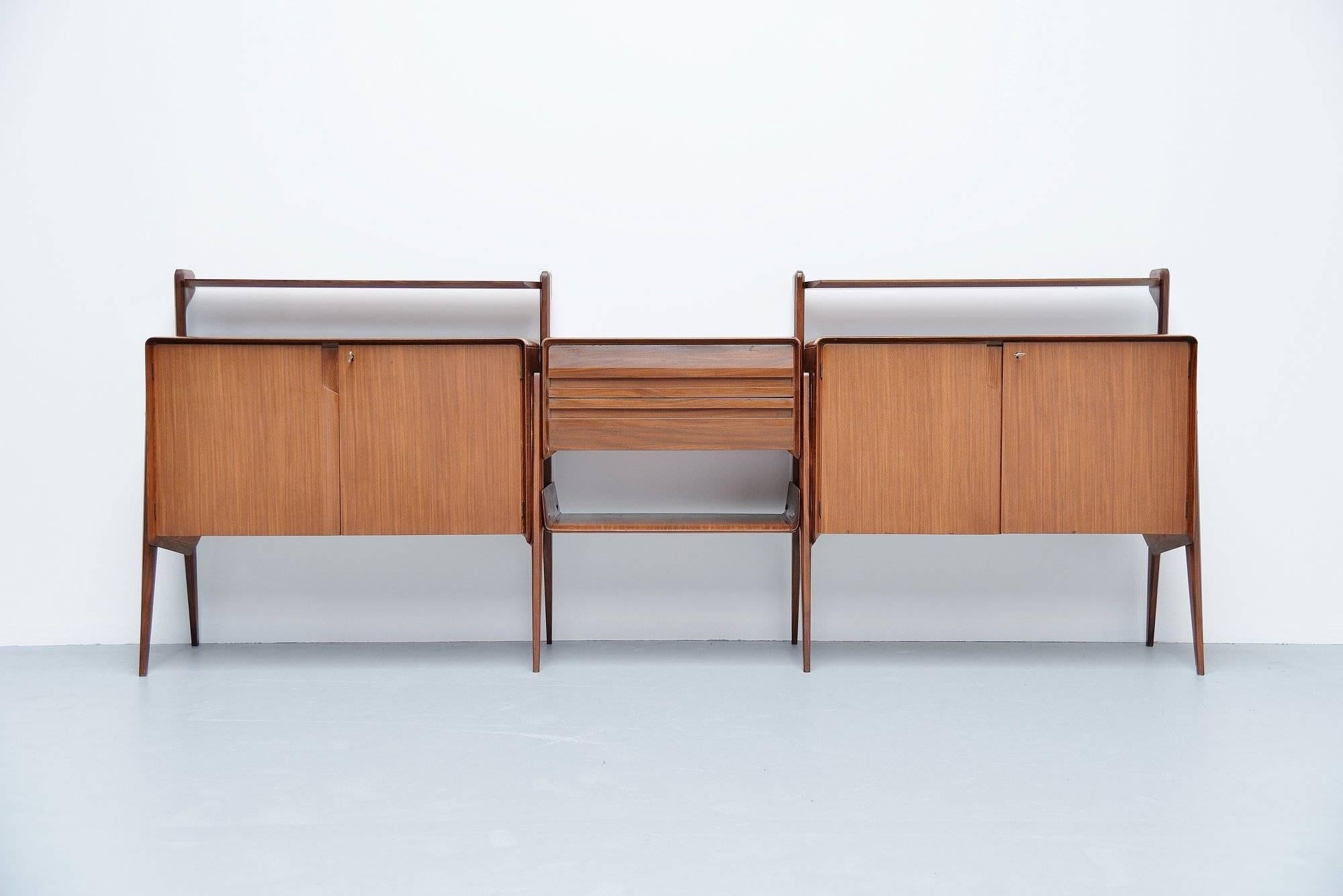 Amazing long and functional sideboard attributed to Ico e Luisa Parisi and manufactured by Cantu, Italy, 1955. This fantastic refined piece of Italian design is made of teak and has typical Italian Ico Parisi lines. The sideboard is in fantastic