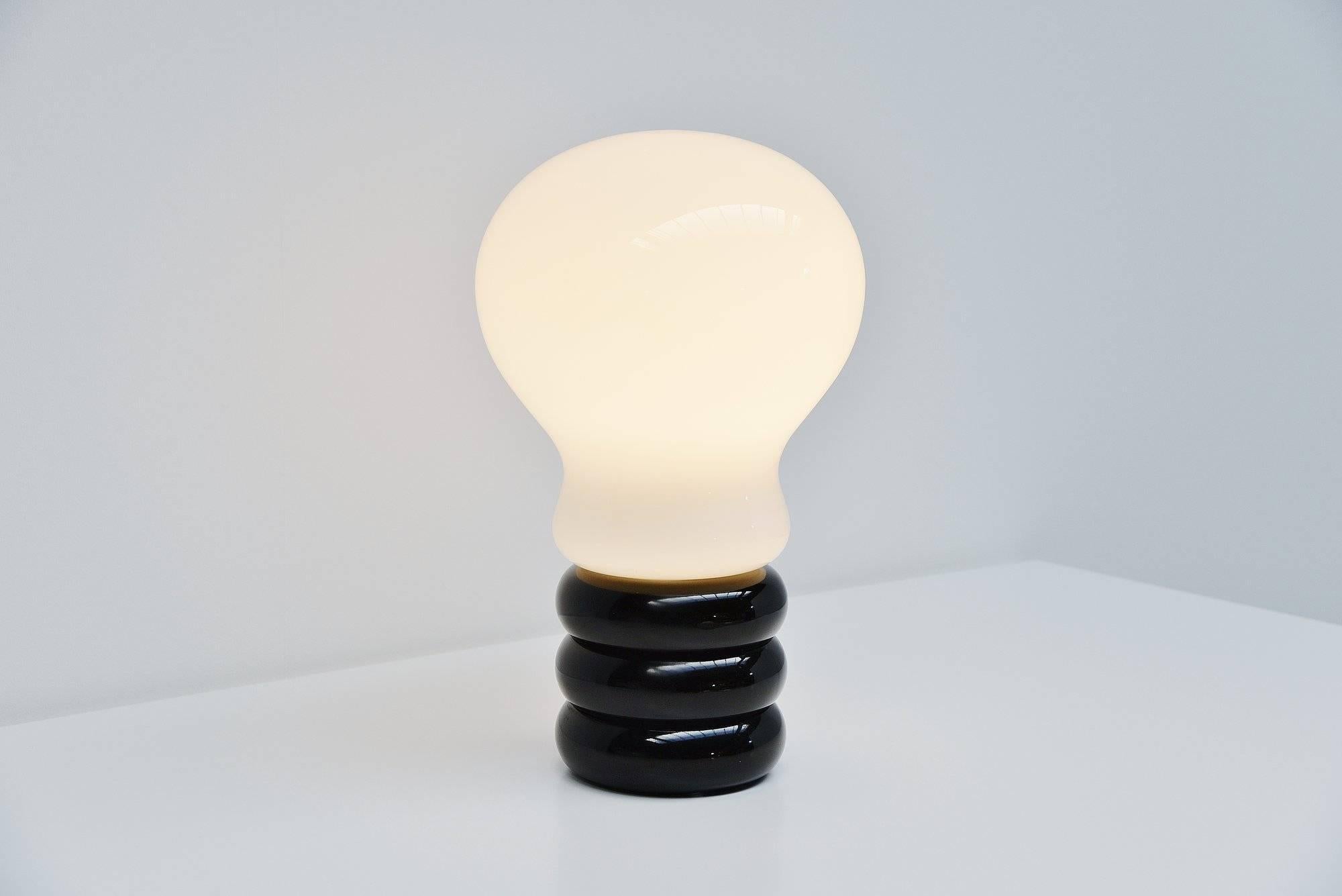 Rare early and large version of the bulb lamp designed by Ingo Maurer, manufactured by M-Design Germany 1966. This lamp has a black painted aluminum base and a white opaline glass shade. This lamp is from the first production and is in very good