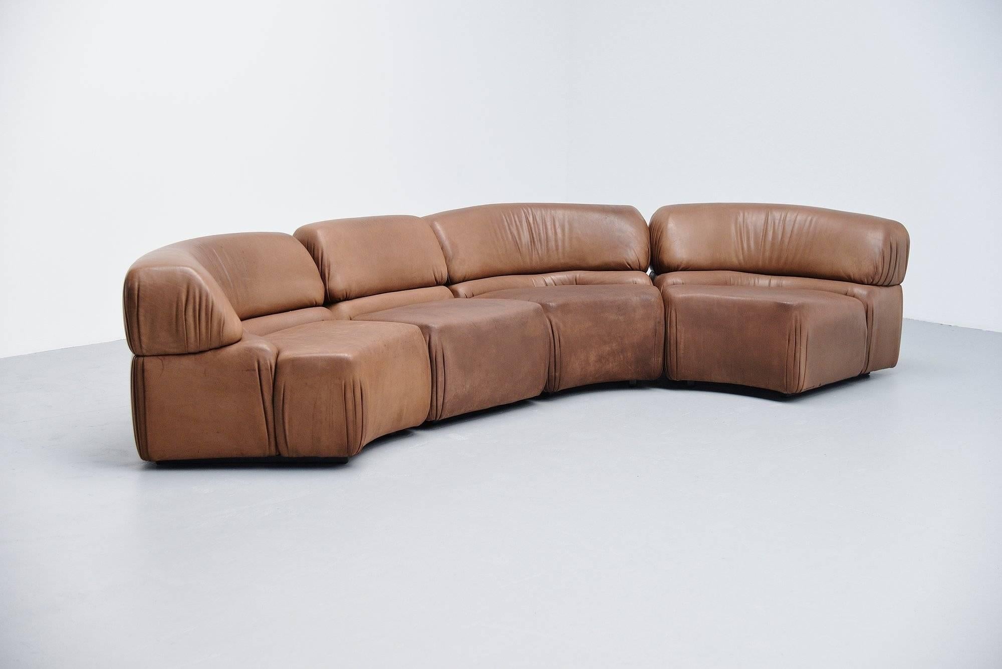 Comfortable so called 'Cosmos' elemented sofa designed and manufactured by De Sede, Switzerland, 1970. This sofa has a wooden structure stuffed with foam and covered with buffalo leather. The sofa is in light brown and is in good original condition