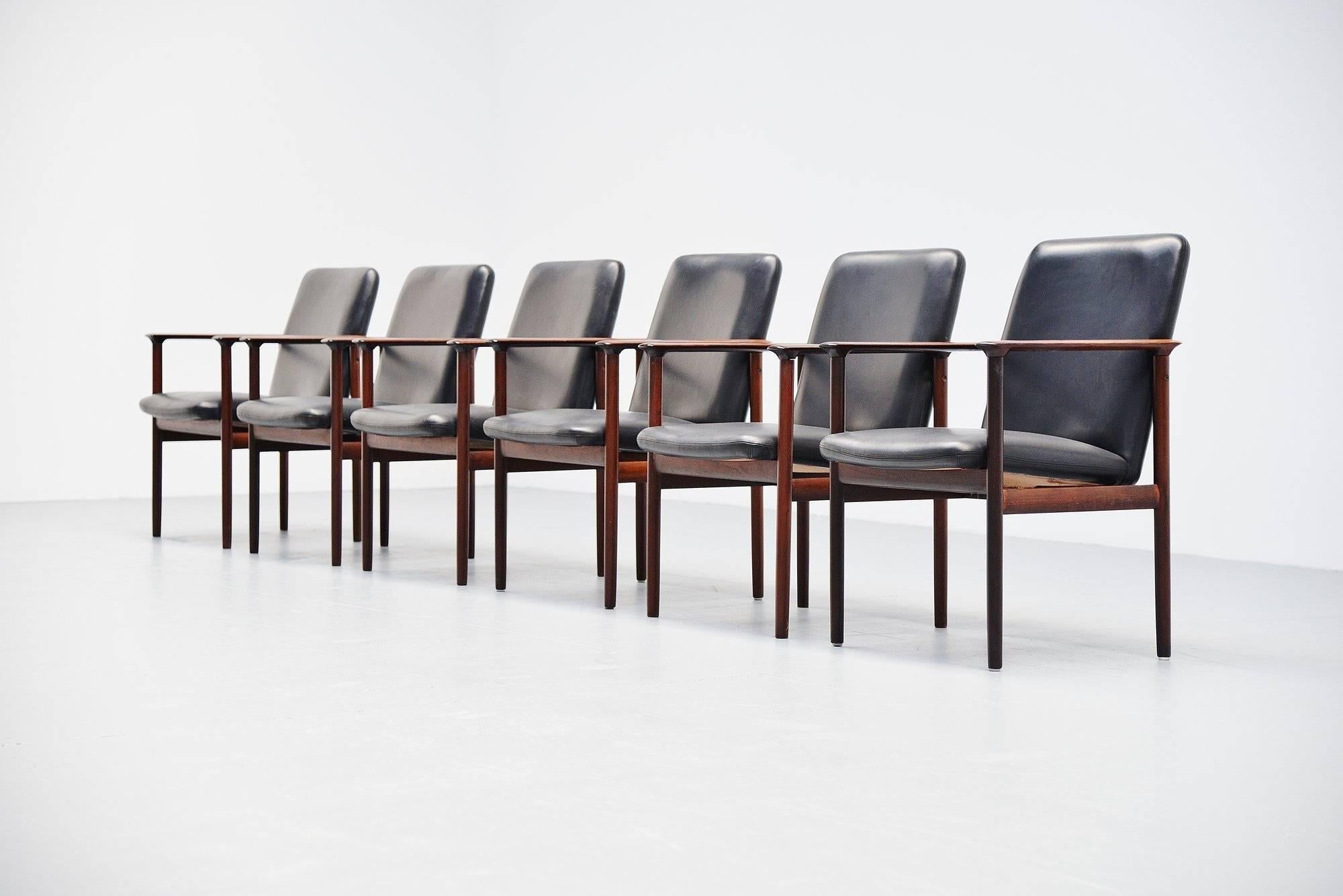 Nice set of 6 conference chairs designed by Cor Bontenbal for Fristho Franeker, Holland 1962. The chairs have rosewood frames and black leather upholstery. The chairs are still in good original condition with a nice patina to the arms, have a look