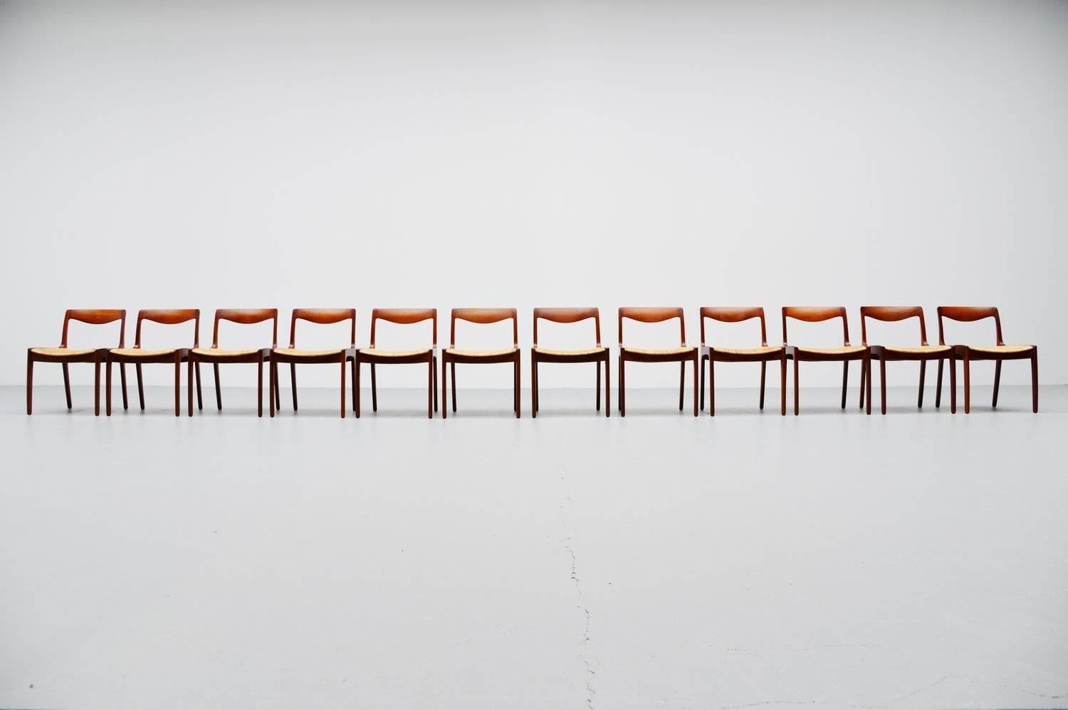 Superb set of 12 dining chairs designed by Vilhelm Wohlert for Poul Jeppesen, Denmark, 1958. These chairs are made of solid sculpted teak wood and have finger joinery and organic backrest. The seats are made of cane which is a great contrast with