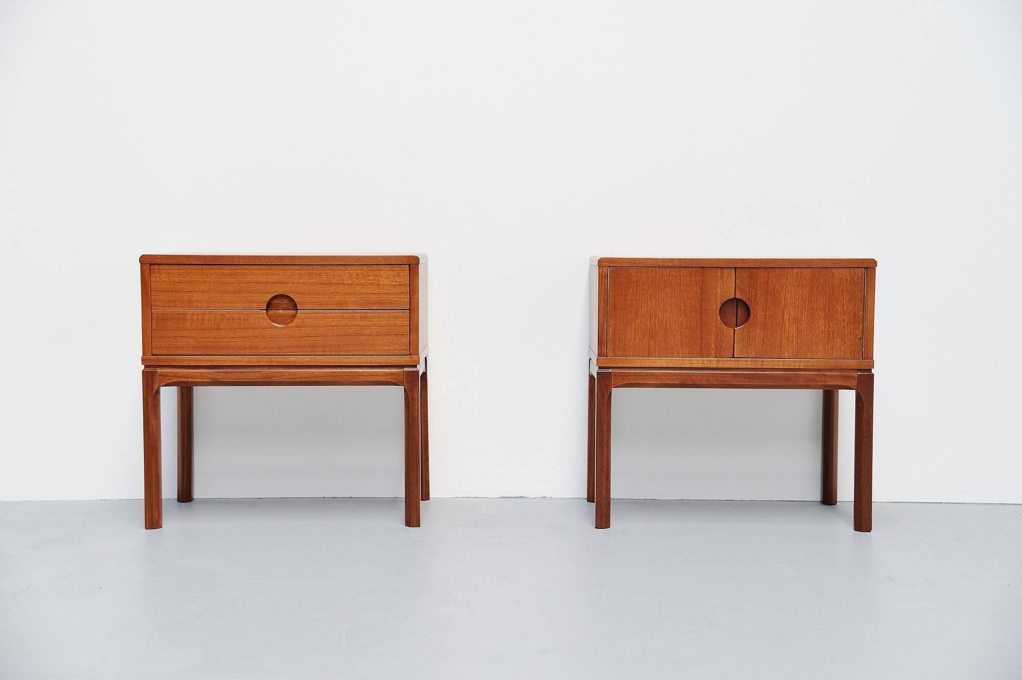 Nice pair of night cabinets designed by Aksel Kjersgaard and manufactured by Odder Mobelfabrik, Denmark 1955. This set of cabinets is made of teak wood and has very nice Danish lines. One cabinet has two drawers; the other one has two folding doors.