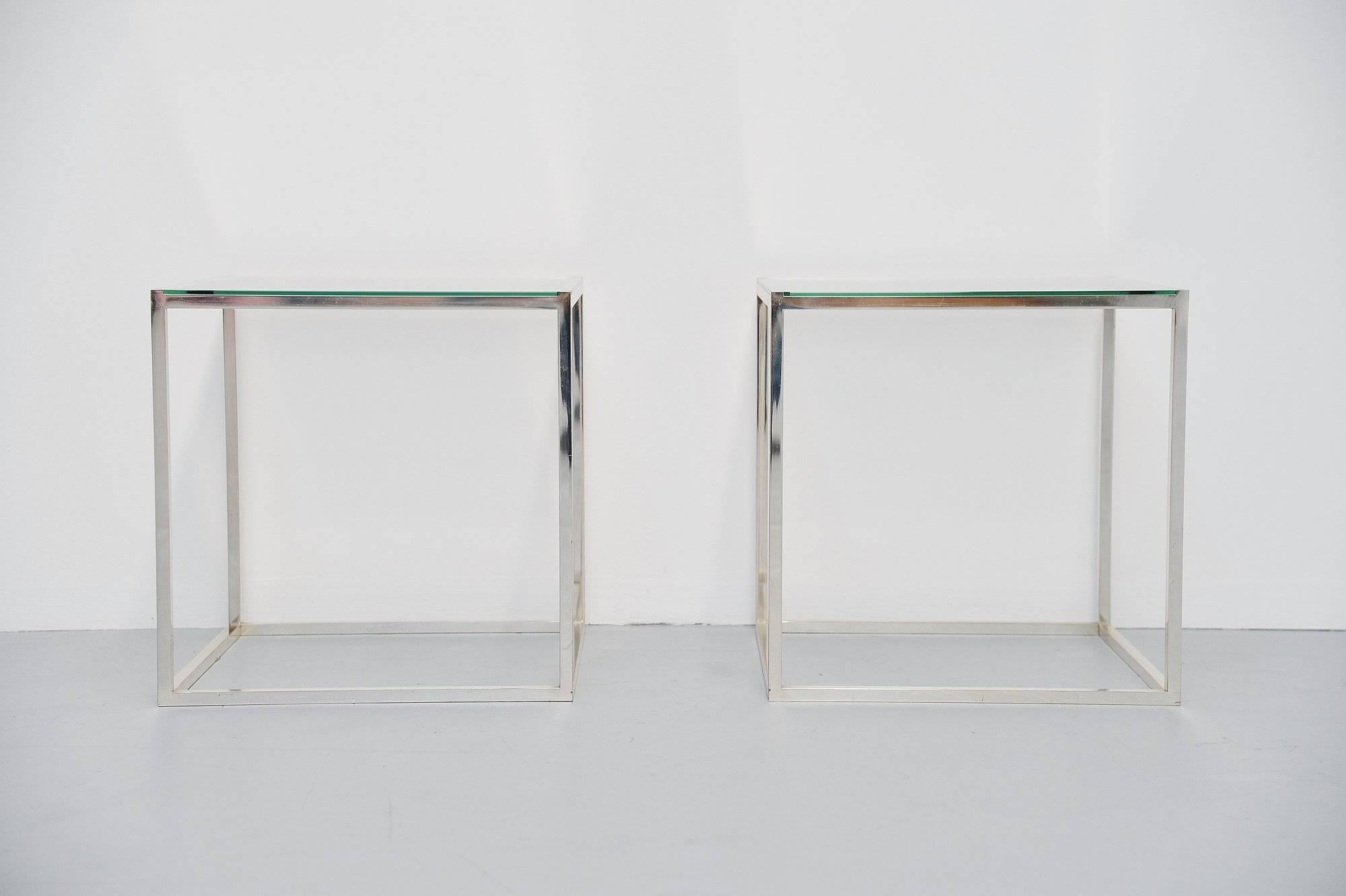 Nice pair of cubic side tables designed and manufactured by Lin Sabattini, Italy, 1970. These tables have silver plated metal frames and glass tops. The frames have a nice patina from age and usage, the glass is in excellent condition. The tables