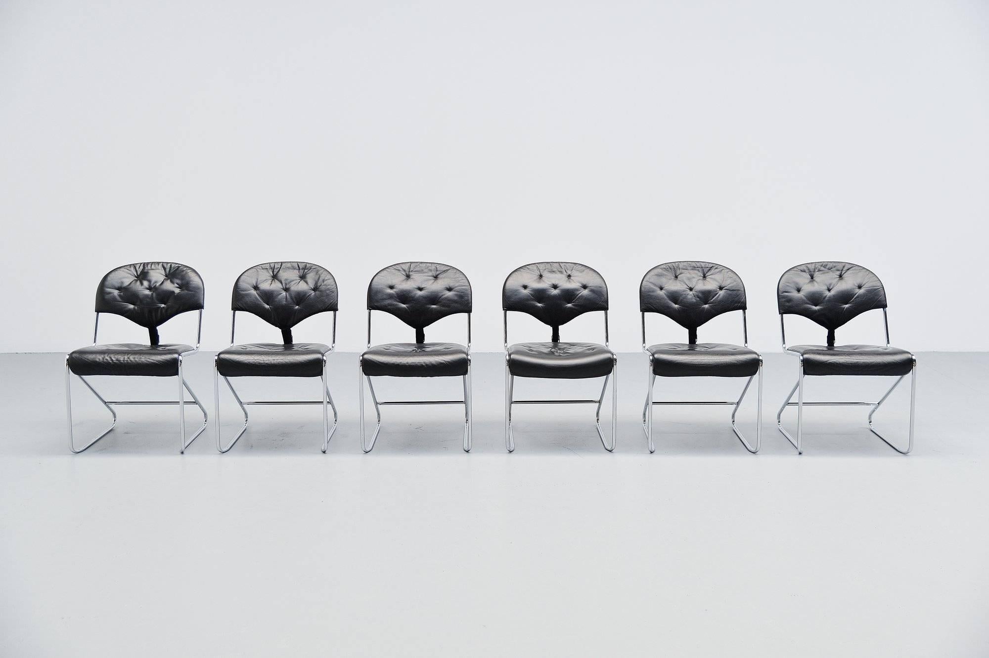 Superb set of dining chairs designed by Sam Larsson and manufactured by DUX International, Sweden, 1970. These chairs have a chrome-plated tubular metal frame, and black leather upholstery. The back of the back rests is strapped with a leather belt