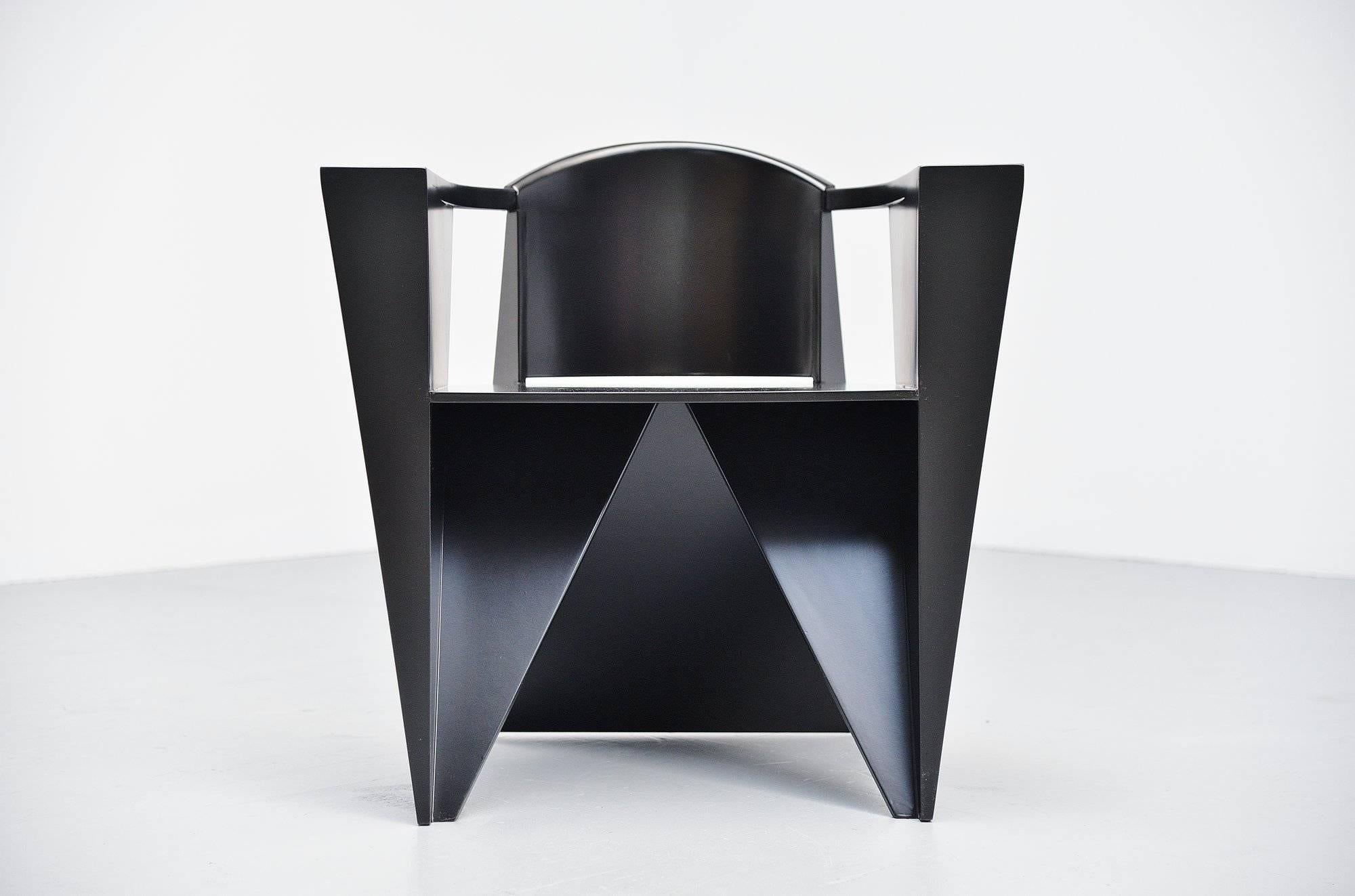 Fantastic shaped Postmodern armchair designed by Adriano & Paolo Suman, manufactured by Giorgetti Spa, Italy 1984. This chair is from the Matrix series designed in 1984. Very nice constructivist chairs made of beech plywood, black lacquered. Very