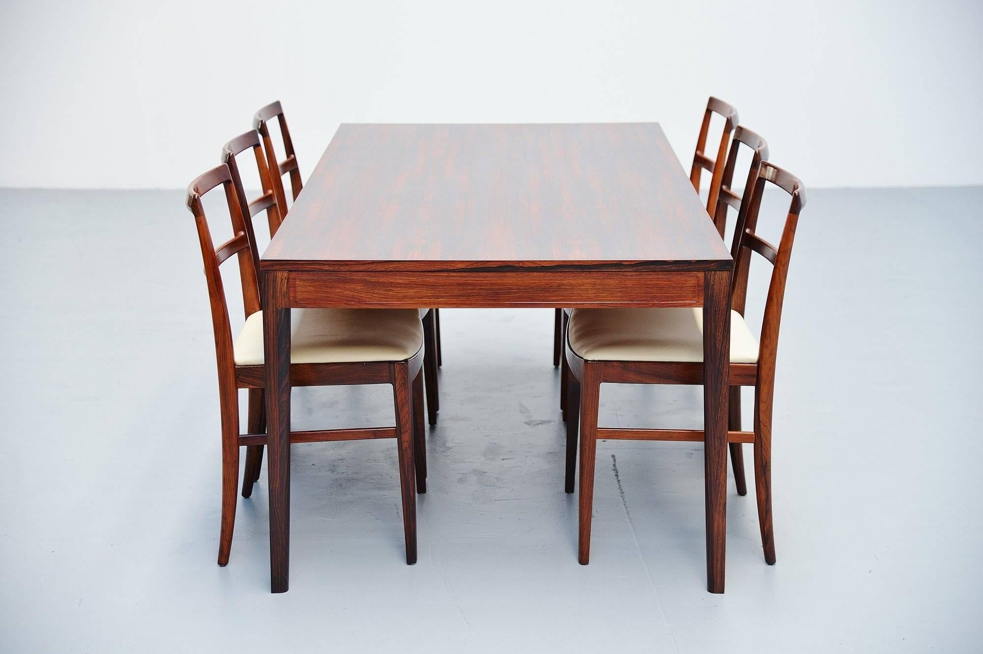 Fantastic grained rosewood dining table designed by Finn Juhl and manufactured by France & Son, Denmark, 1962. This table is from the 'Diplomat' office series, there were also desks and cabinets from these series. This is for a very nice and lovely