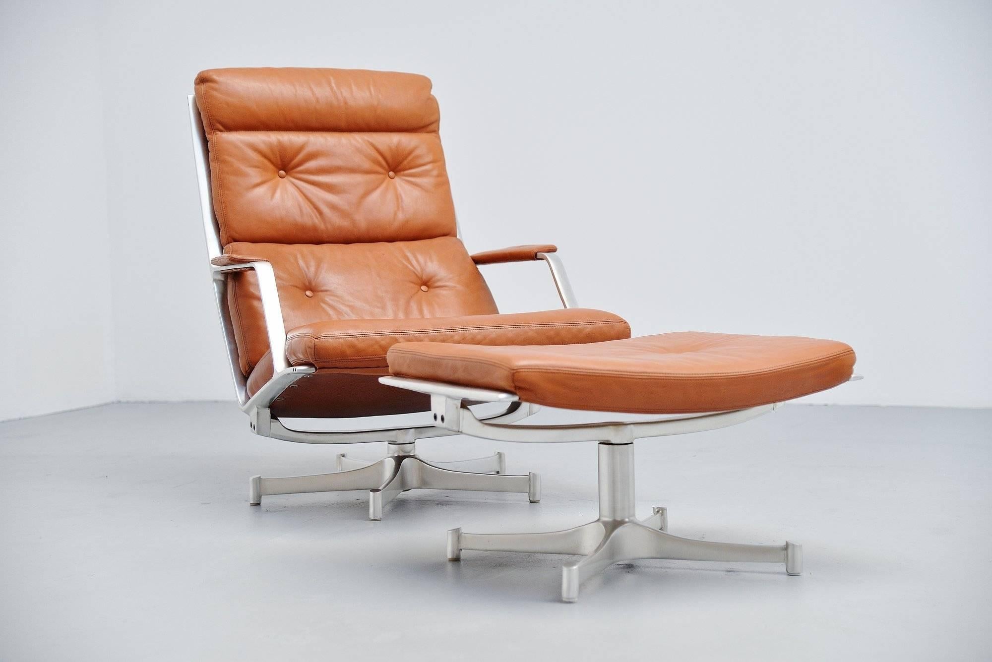 Stunning lounge chair model FK85 designed by Preben Fabricius & Jorgen Kastholm and manufactured by Kill International, Germany 1963. This chair has a heavy solid brushed steel frame and is covered with lovely cognac leather. The leather is in