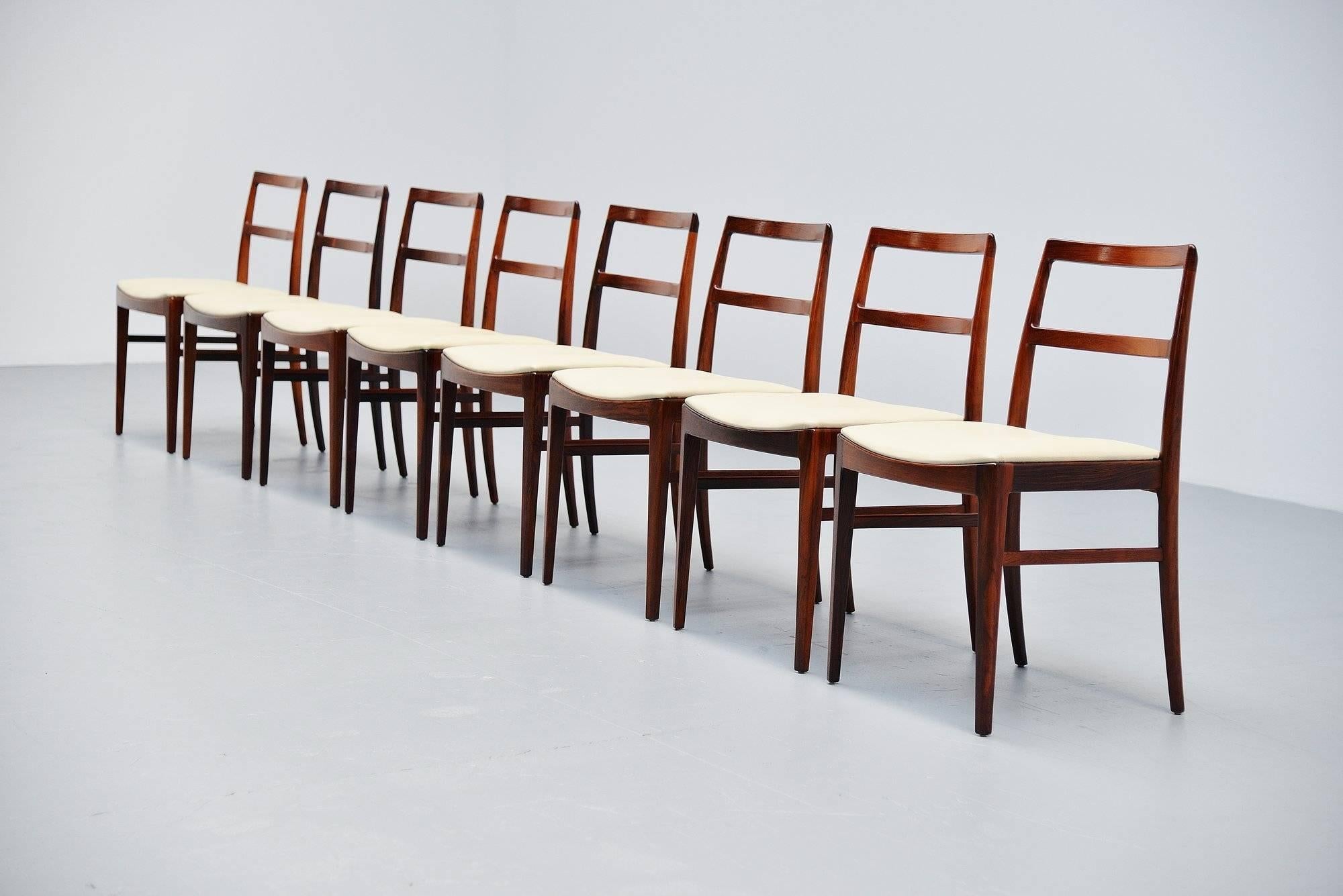 Very nice set of eight dining chairs designed by Arne Vodder and manufactured by Sibast Mobler, Denmark, 1960. These chairs are model 430 and made in solid rosewood. They are newly upholstered in creme leather upholstery of high quality. The chairs
