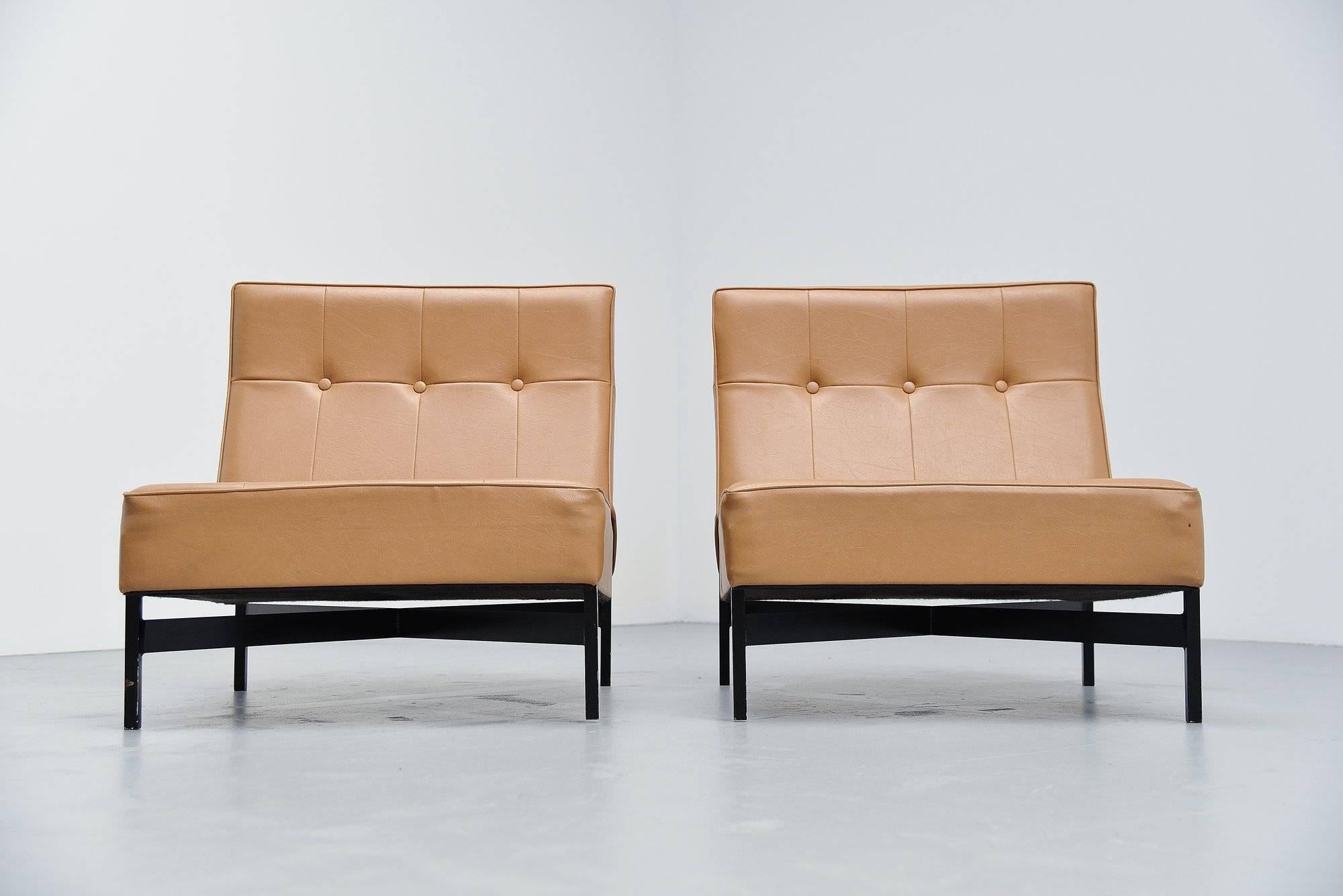 Rare unique pair of chairs designed by architect Wim den Boon, Holland, circa 1965. These super chairs were inspired by the modular sofa by Nelson and the chairs by Florence Knoll in the days. They are made of a black square tubular frame and camel