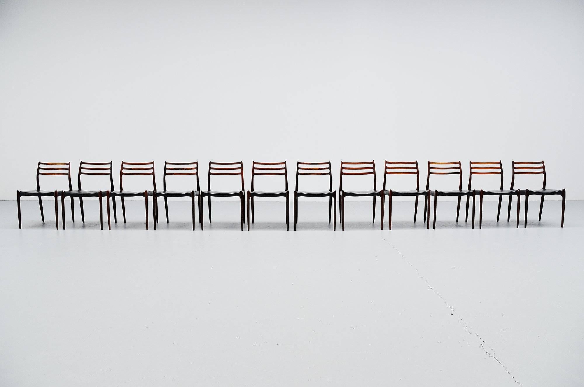 Sculptural dining chairs designed by Niels O. Møller, manufactured by J.L. Møller Mobelfabrik, Denmark, 1962. These lovely chairs are made of solid rosewood and still have their original upholstery in black faux leather which is still okay with nice