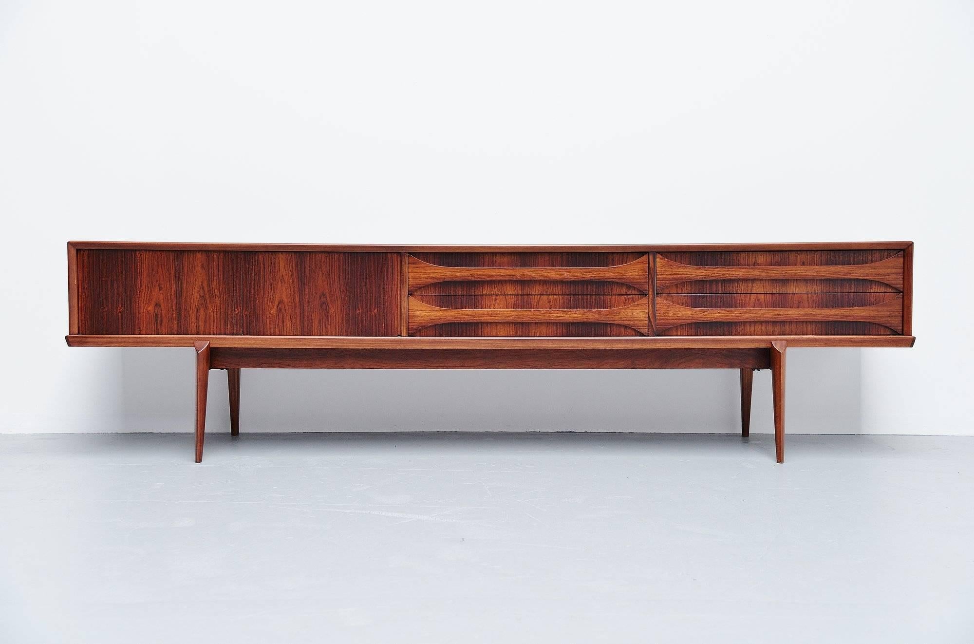 Very nice and quality low sideboard designed by Oswald Vermaercke for V-Form, Belgium, 1959. This amazing credenza has a very nice and warm rosewood color and is fully refinished into perfect condition. The designs by Oswald Vermaercke are visibly