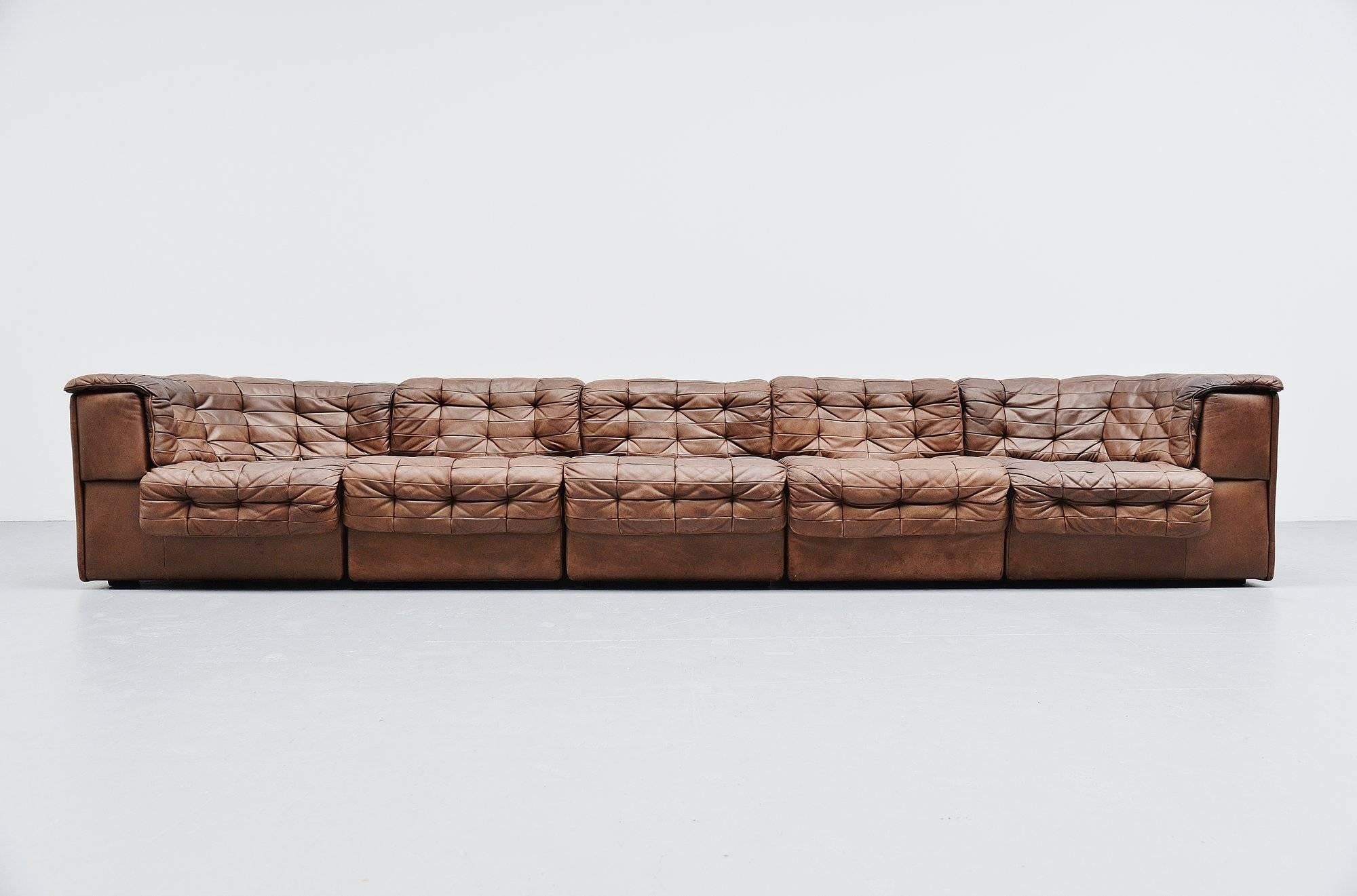 Very nice and comfortable lounge sofa model DS11 designed and manufactured by De Sede, Switzerland 1970. This sofa exists in five pieces, two corner elements and three middle elements. The sofa has a very nice chocolate brown color and has a very