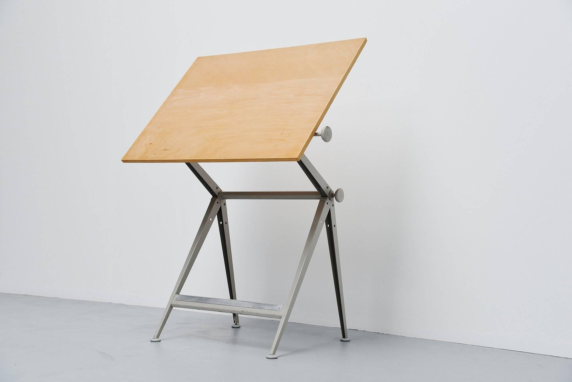 Ingenious 'Reply' drafting table designed by Wim Rietveld and Friso Kramer for Ahrend de Cirkel, Holland 1963. The table is adjustable in numerous positions using an ingenious adjusting system using only two screws at the side. This table won a