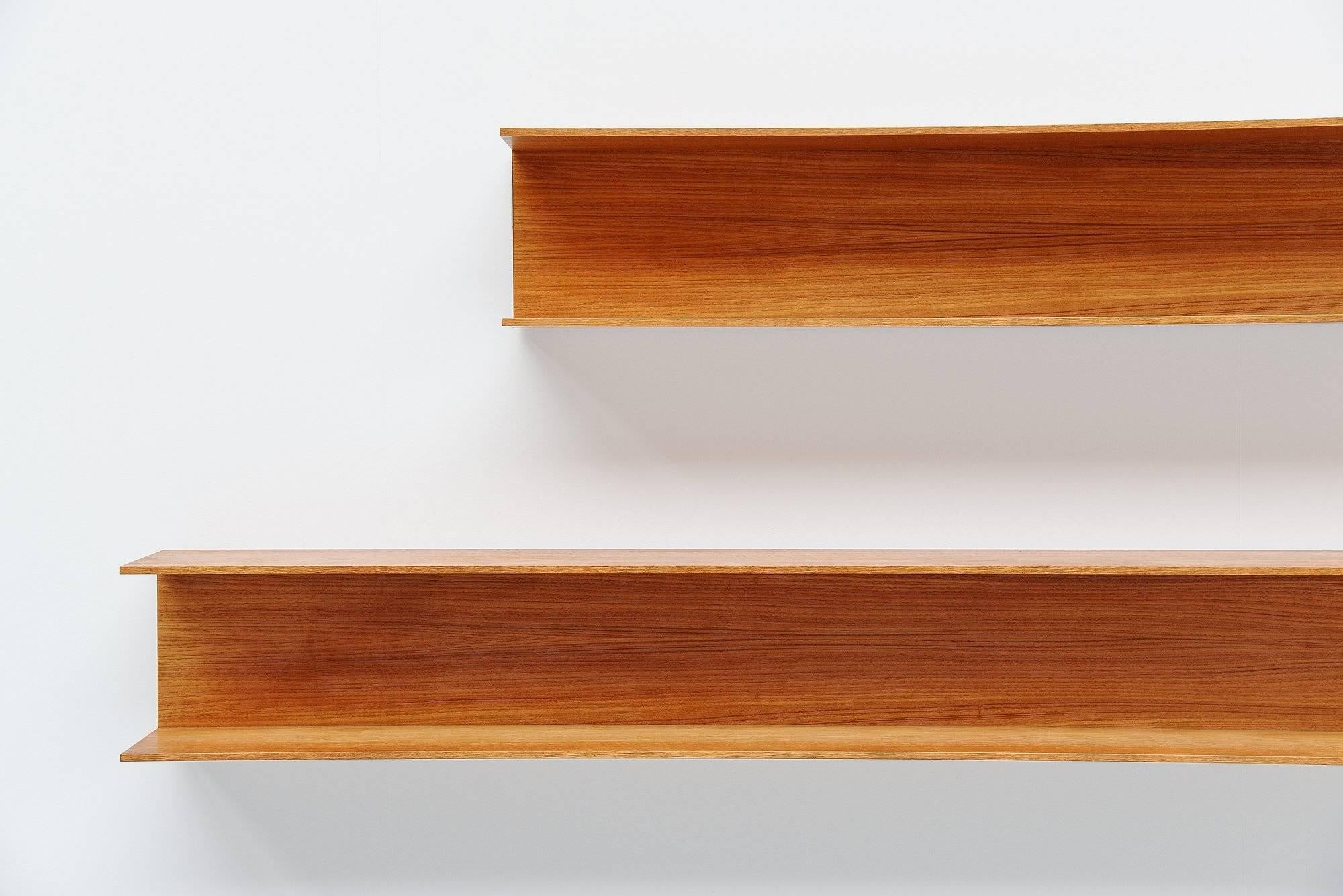 Very nice set of three large wall shelves designed by Walter Wirtz and manufactured by Wilhelm Renz, Germany, 1965. These shelves are made of teak wooden veneer and are easy to wall hang using only 2 screws per shelve. Very nice modernist set of