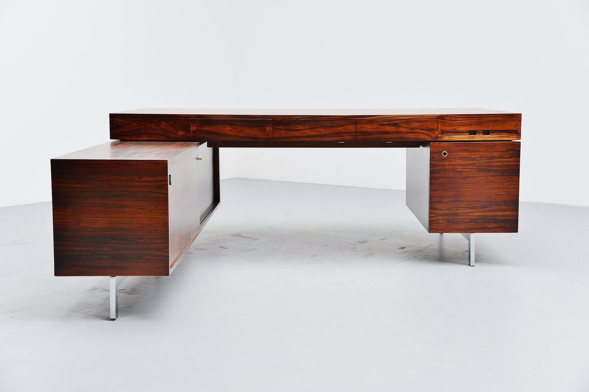Fantastic large rosewood conference desk, Denmark, 1960. The desk is made of super quality rosewood veneer and is fully refinished. The desk has a very nice and warm grain to the rosewood. On the left there is a sideboard for storage and there are