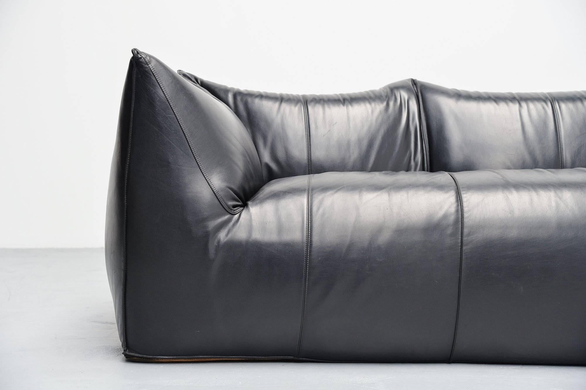 Amazing quality and comfortable three-seat 'Bambole' sofa, designed by Mario Bellini for B&B Italia in 1972. Very nice and high quality usable large sofa. Very nice shaped sofa made of high quality black buffalo leather. This black leather sofa has