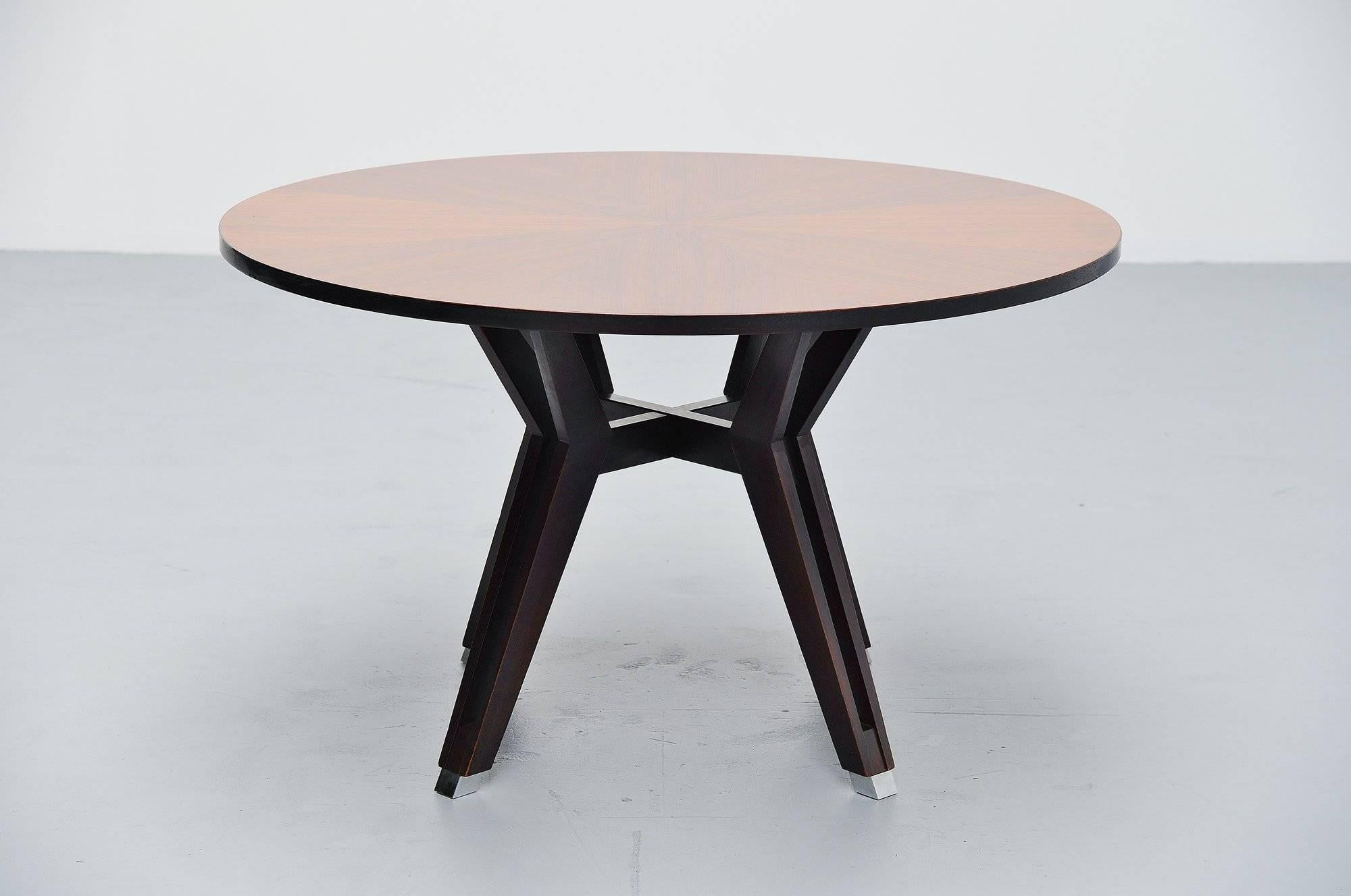 Superb dining table designed by Ico Paris for MiM Roma, Italy, 1958. The table is made of rosewood and has metal protected feet. The table has a very nice shiny lacquer finish on the top and a nice grain to the rosewood. It is marked with the MiM