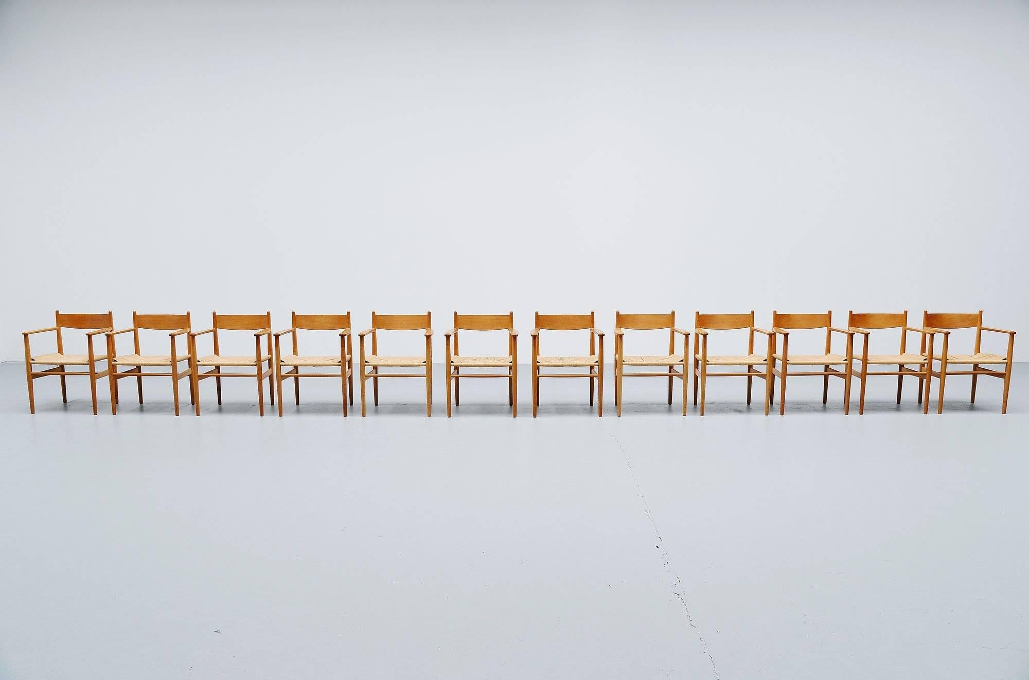 Extraordinary large set of CH37 armchairs designed by Hans J Wegner and manufactured by Carl Hansen, Denmark, 1962. The chairs have a solid oak wooden frame and papercord seats.Simple, functional and thoughtfully made, this 1962 Wegner design