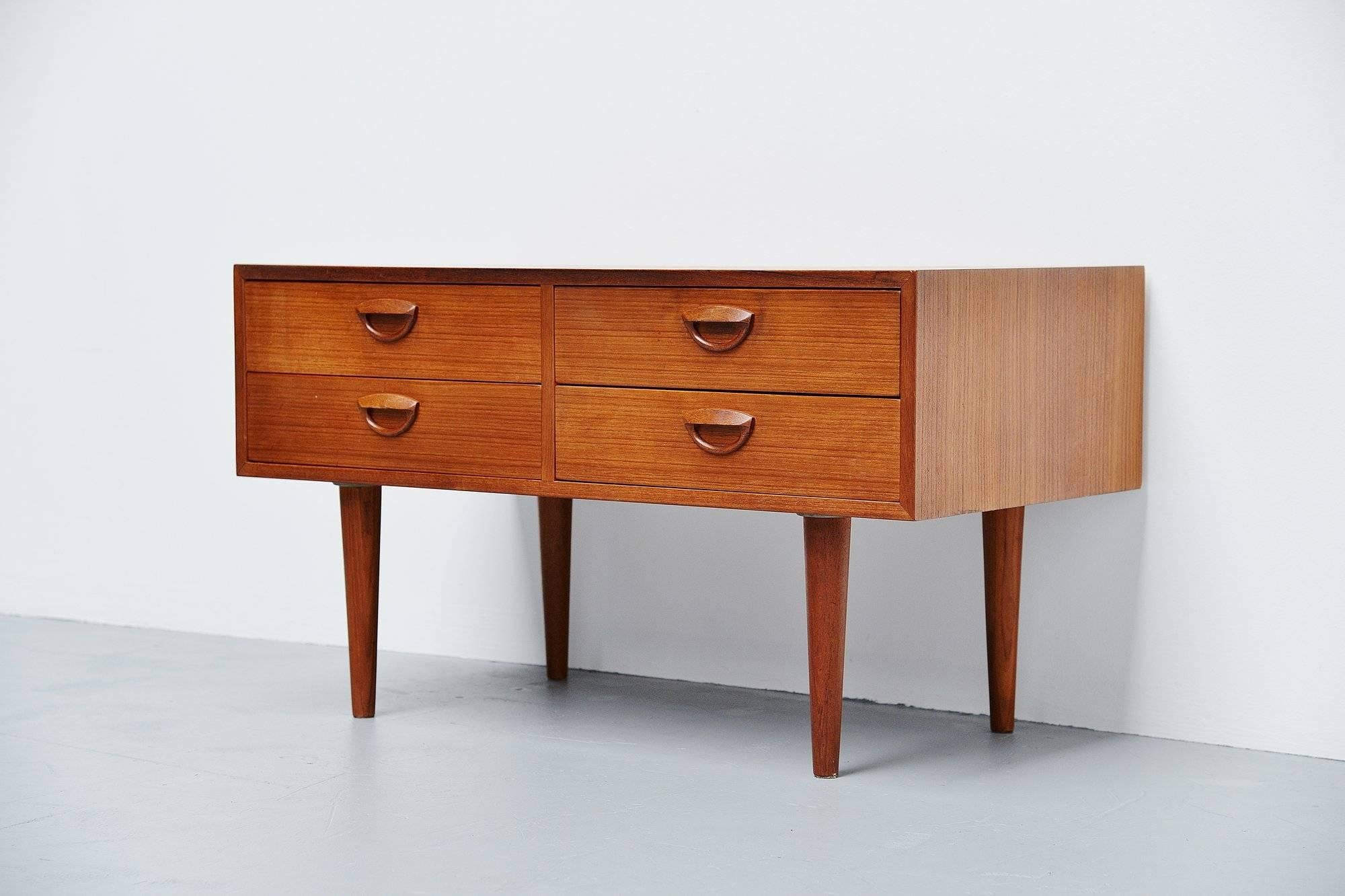Nice and subtle chest of drawers designed by Kai Kristiansen and produced by FM Mobler, Denmark, 1960. This small chest of drawers has four deep drawers and could be used nicely as a TV table or something. The cabinet is in original condition and