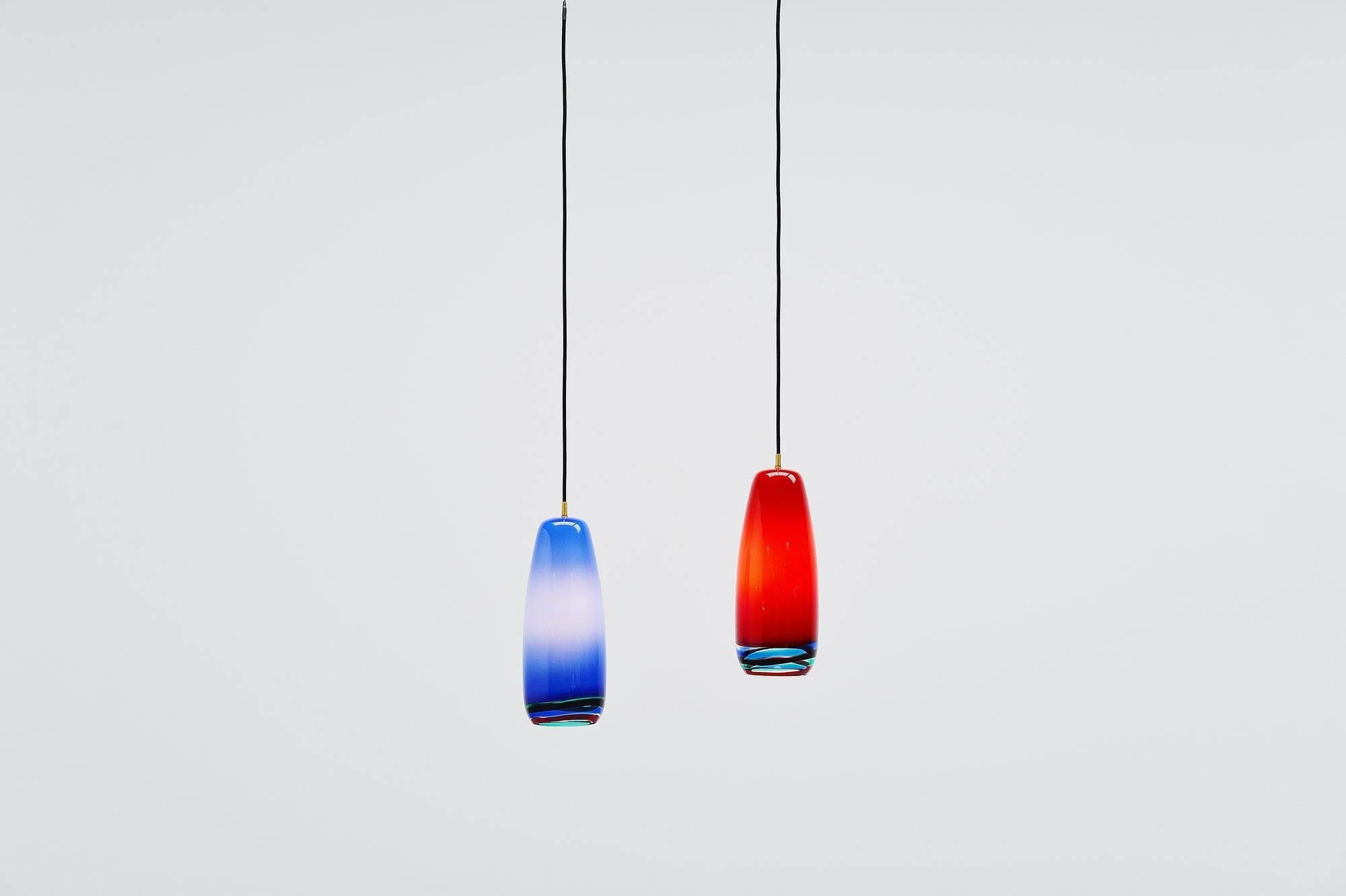 Nice pair 'Sigaro' pendant lamps designed by Massimo Vignelli and manufactured by Venini, Italy 1954. Rare pair of lamps, give fantastic light when lit. We have a large group of these lights in stock, they come from a hotel in Italy. Also available