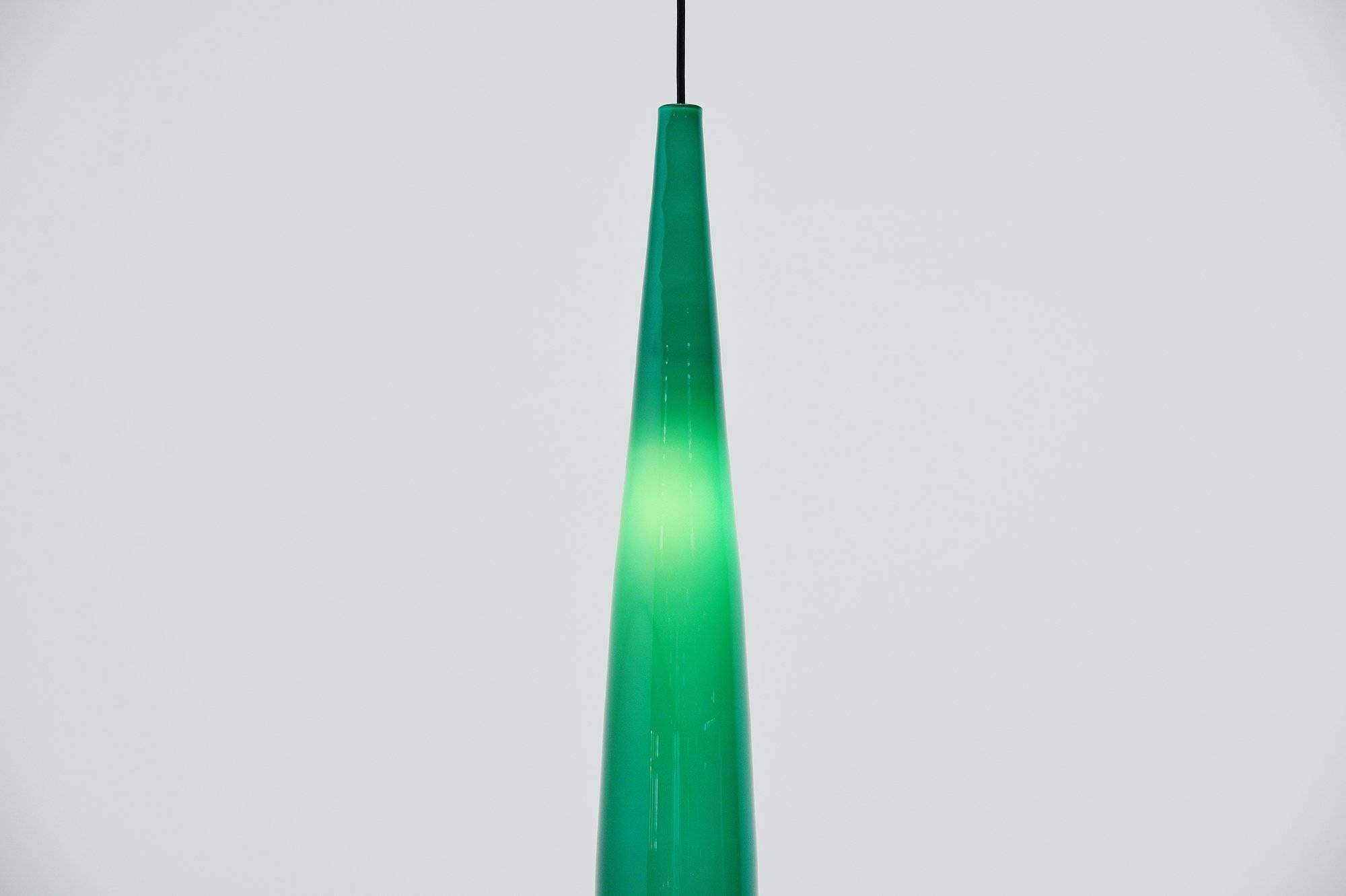 Highly decorative long tube pendant lamp designed by Alessandro Pianon and manufactured by Vistosi, Italy, 1960. This blown glass lamp has a very nice sea green color and whit inside. The lamp gives very nice and spherical light when lit and uses an