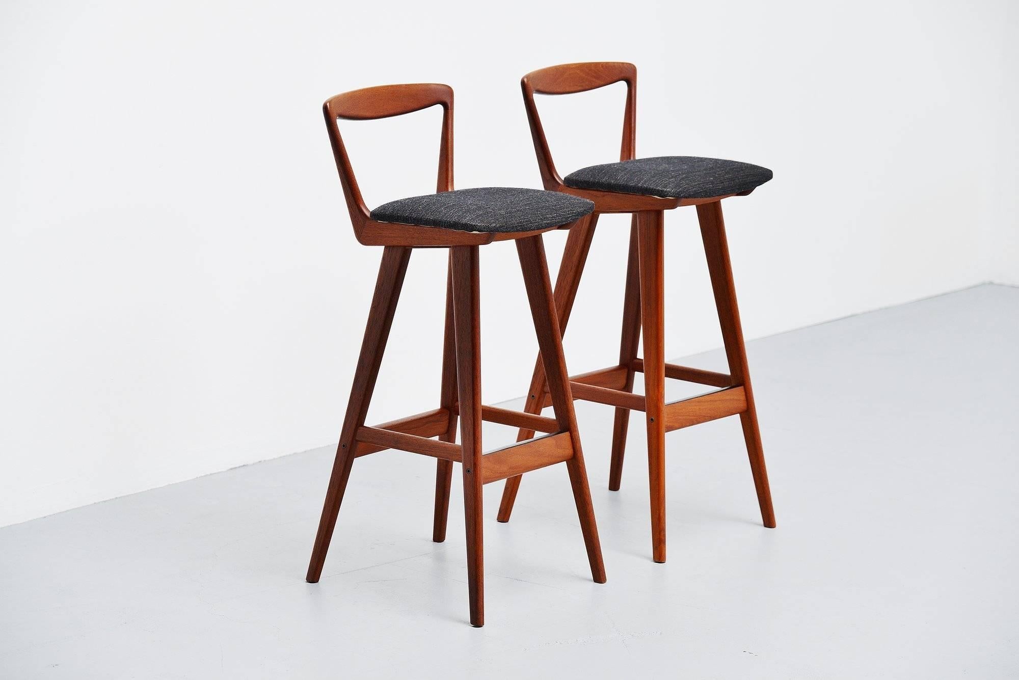 Sophisticated set of bar stools designed by Henry Rosengren Hansen and manufactured by Brande Møbelindustri, Denmark, 1960. These stools have a solid teak wooden frame and their original brown/grey upholstered seats. These stools are very