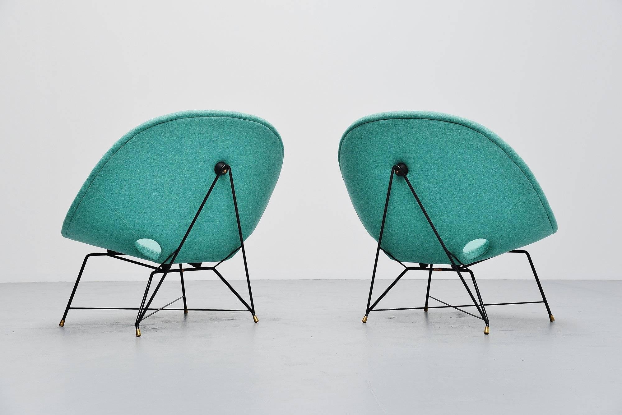 Super rare cosmos lounge chairs designed by Augusto Bozzi for Saporiti Italia, Italy, 1954. These chairs have a black lacquered metal wire frame with solid brass feet. The chairs are newly upholstered with Flora fabric by Kvadrat so they are in