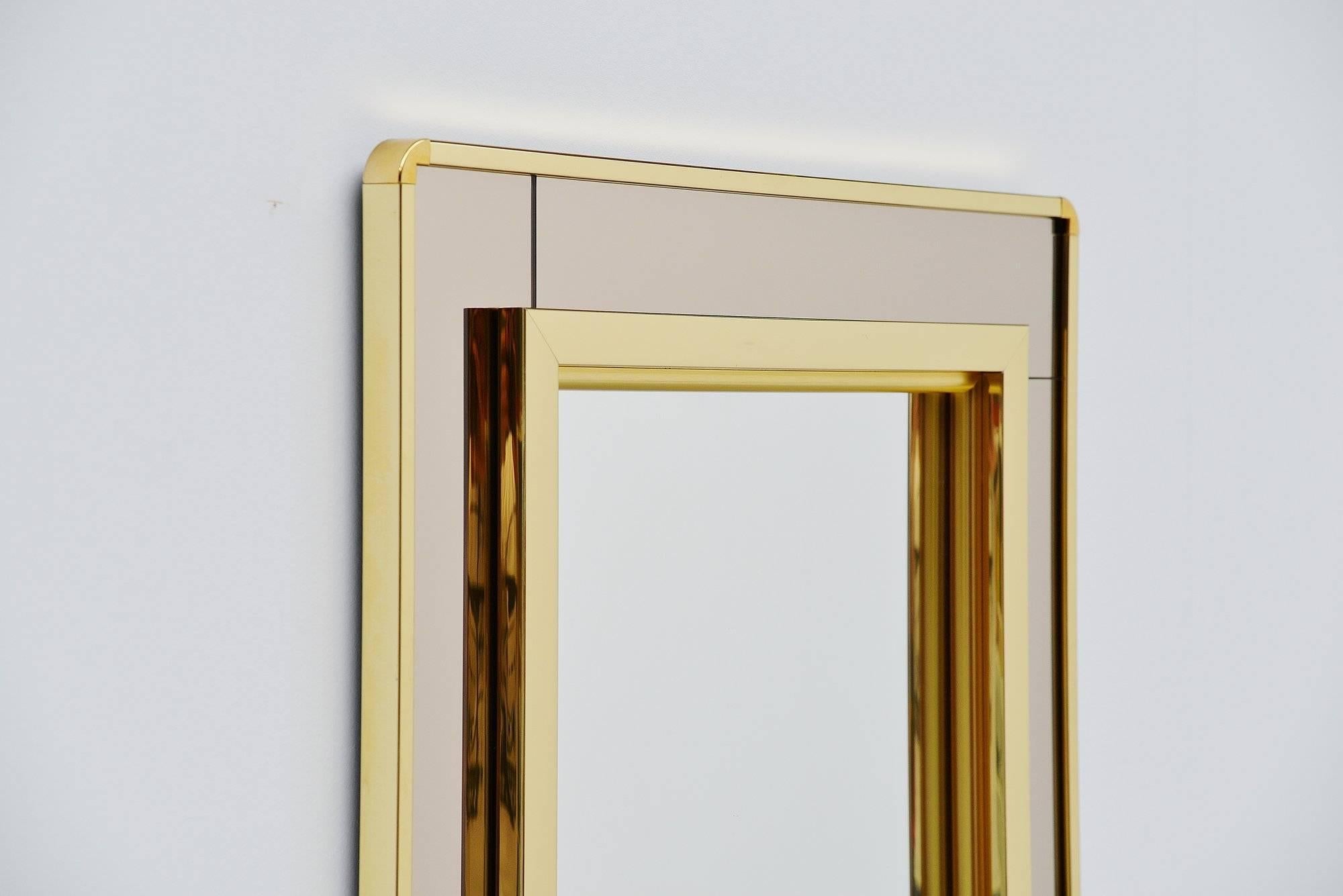 Decorative wall-mounted mirror in the style of Romeo Rega and Willy Rizzo, Italy, 1970. The mirror is made of brass anodized aluminium and is made of heavy quality materials. Easy to wall hang and highly decorative. In excellent clean condition.

 