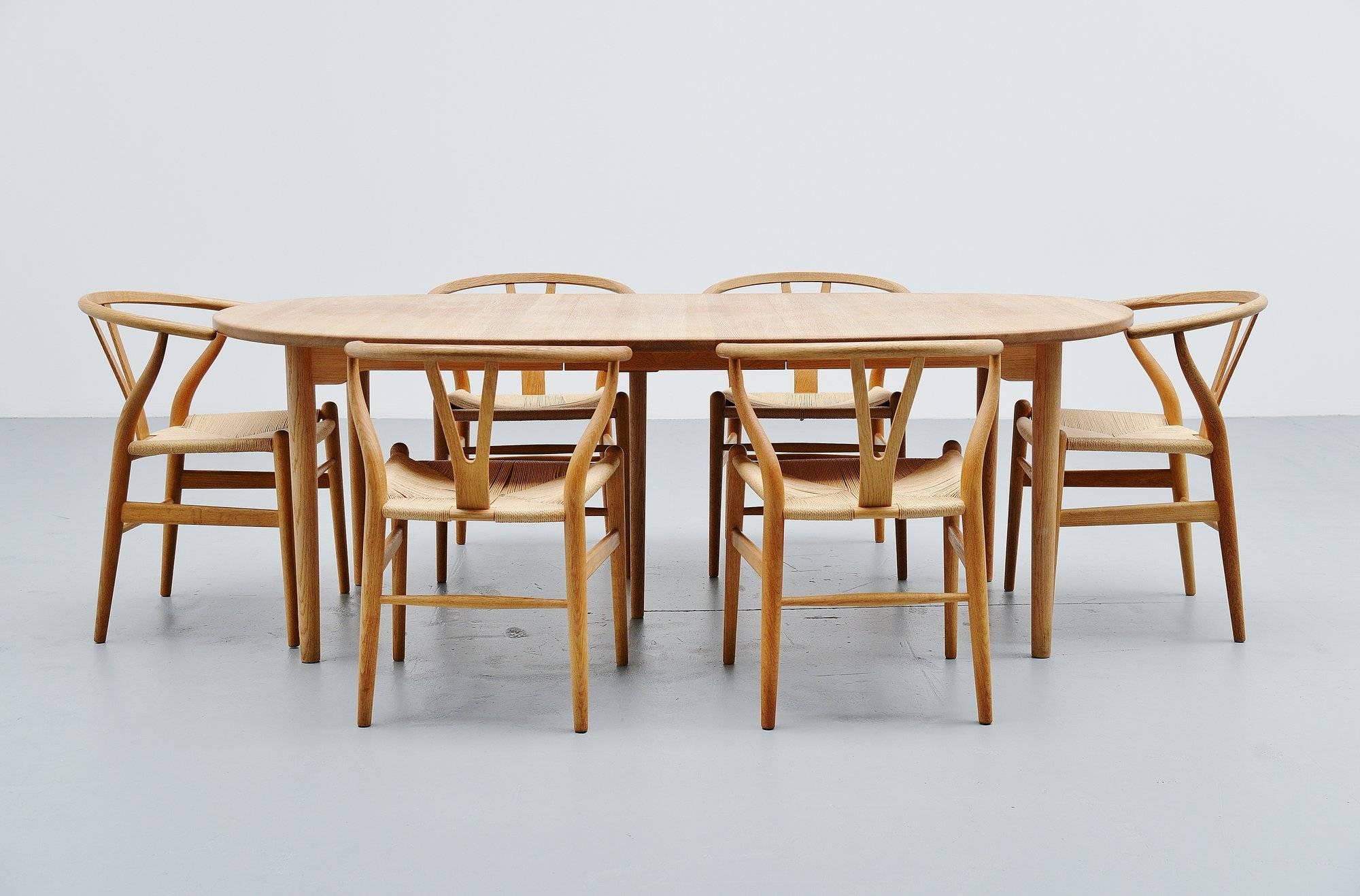 Very nice oval dining table designed and manufactured by Brdr. Andersen Møbelsnedkeri, Denmark, 1970. This table is made of solid oak, treated with soap. The maintenance box with soap and instructions is included with the table. The table has one