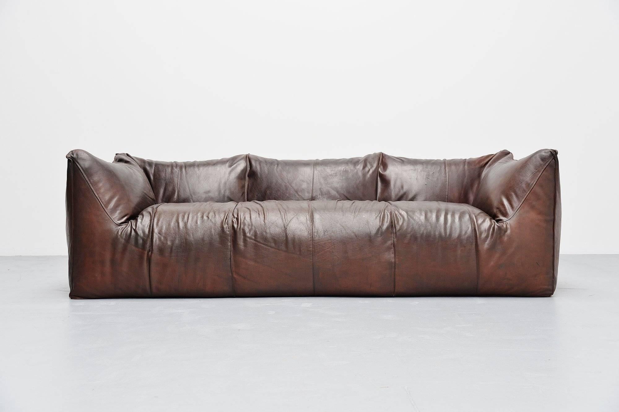Highly rare and comfortable three-seat 'Bambole' sofa, designed by Mario Bellini for B&B Italia in 1972. Very nice and high quality usable large sofa. Very nice shaped sofa made of very thick and high quality brown buffalo leather. This dark brown