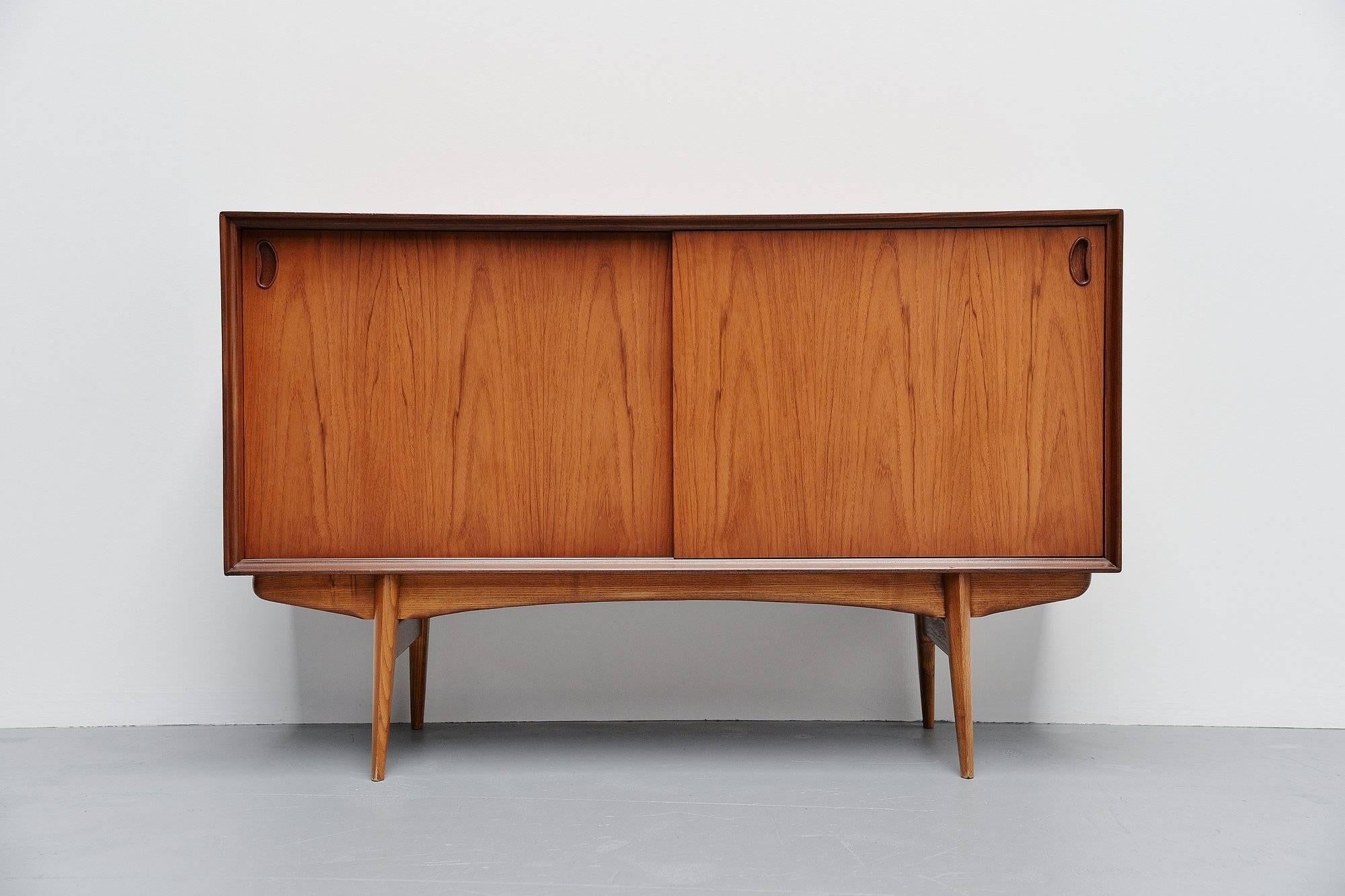 Rare small credenza designed by Oswald Vermaercke, manufactured by V-Form Belgium 1959. This credenza is from the Paola series designed by Vermaercke in 1959. This is for an unusual small two doors credenza. The credenza is made in teak wood and has