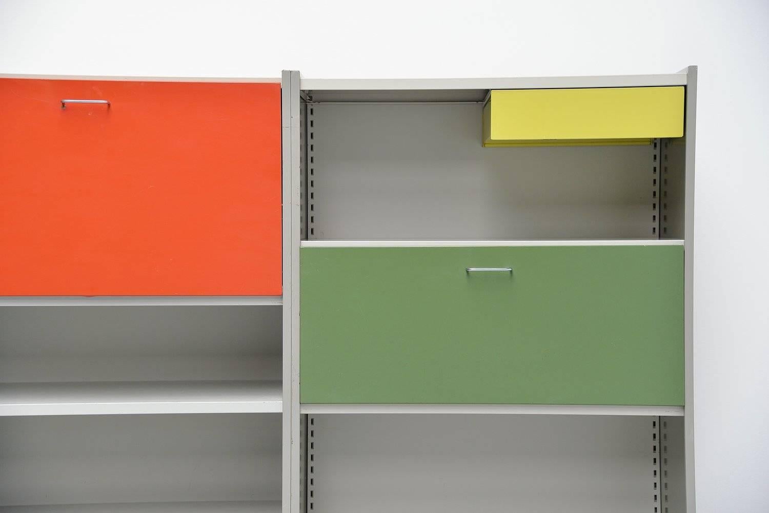 Very nice and large storage unit designed by Andre Cordemeijer for Gispen Culemborg, Holland 1962. This amazing storage unit was designed for multi purposes, offices, home, stores. Because it was made to build in all sorts of options, its a modular