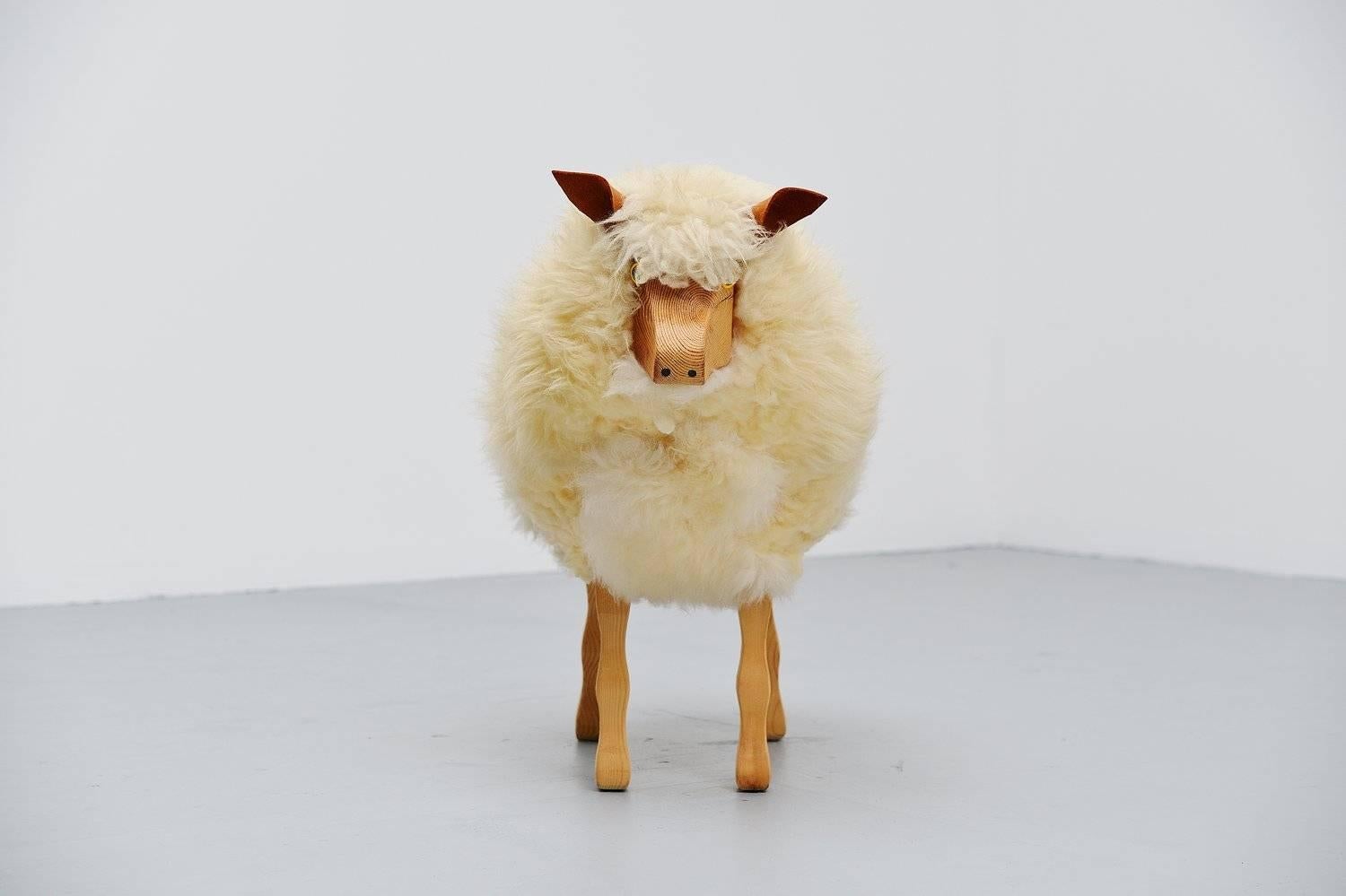 Very nice decorative sheep made by unknown manufacturer in the manner of Francois Xavier Lalanne, Germany 1970. This sheep was made of solid pine and is covered with real sheep wool, its ears are made of leather. These sheep were designed as shop