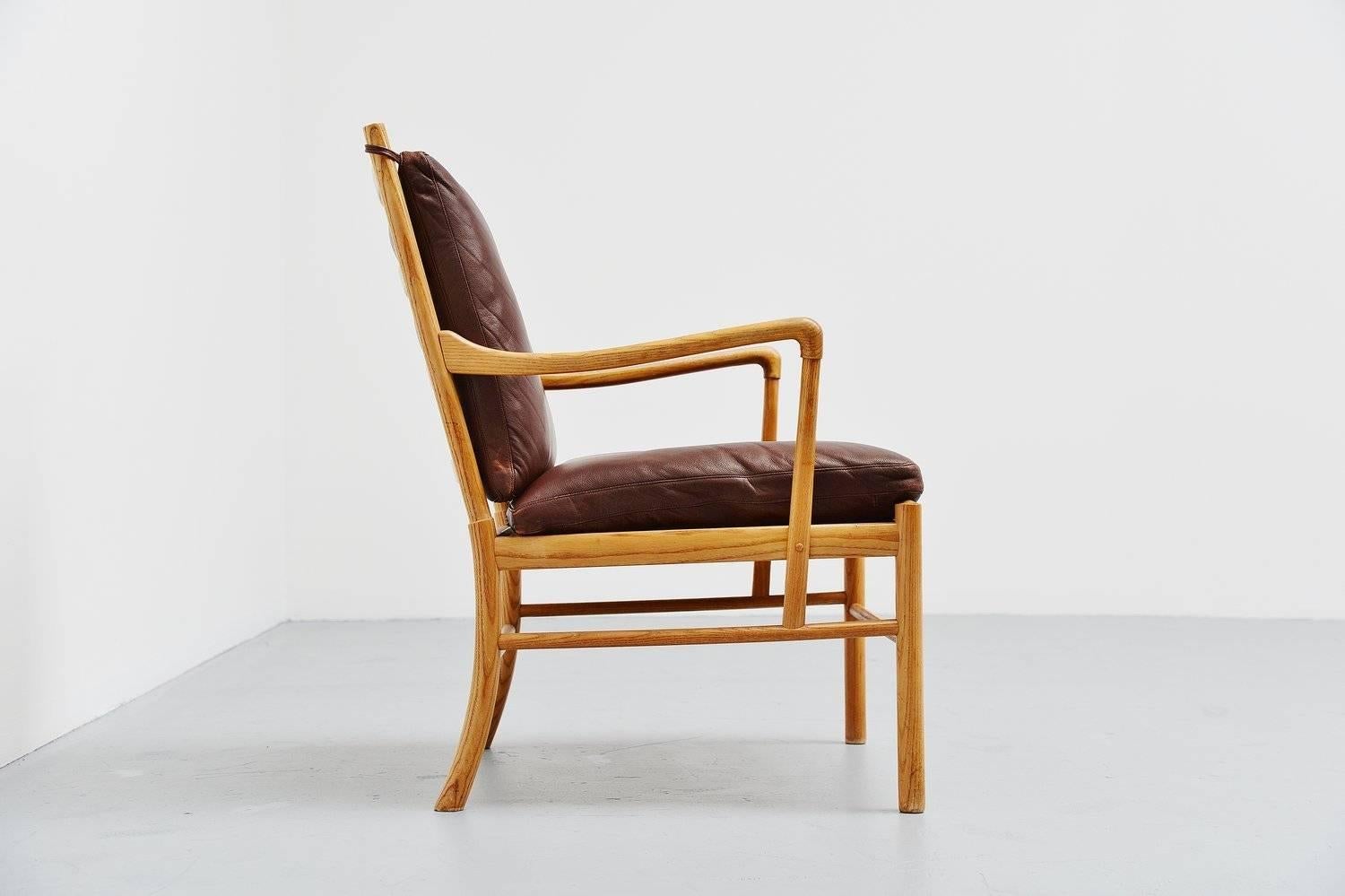Very nice lounge chair model PJ 149 also called Colonial, designed by Ole Wanscher for P. Jeppesen, Denmark 1959. This chair is made of solid oak and it has a cane seating support which was professionally restored and checked. The original brown