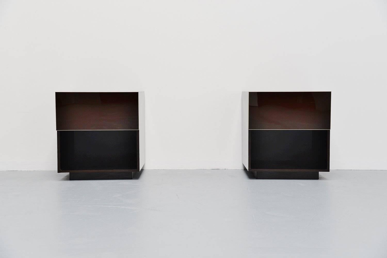 Very nice pair of nightstands designed and made by Jean Claude Mahey, France, 1970. These high quality nightstands are made of brown Plexiglas, and are finished with a brass edge. Identical cabinets both with one drawer and storage compartment
