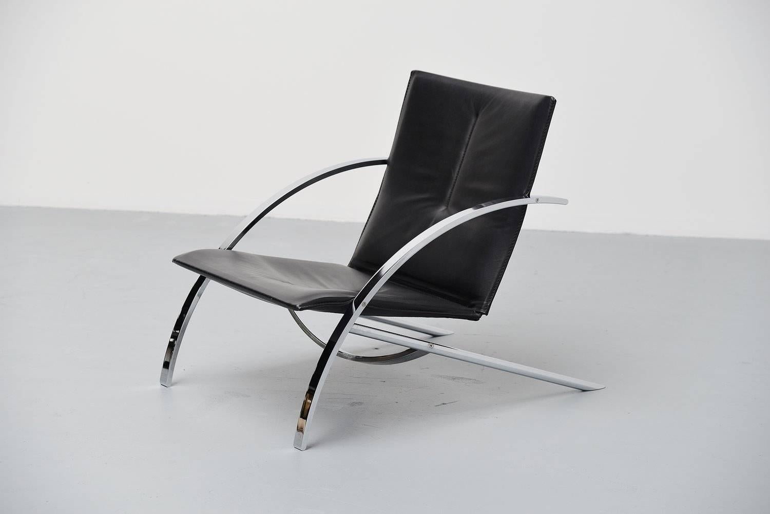 Fantastic lounge chair model Arco designed by Paul Tuttle for Strässle International, Switzerland 1976. Super heavy quality lounge chair in heavy solid chrome plated metal and high quality black leather upholstery. I don't think this chair was used