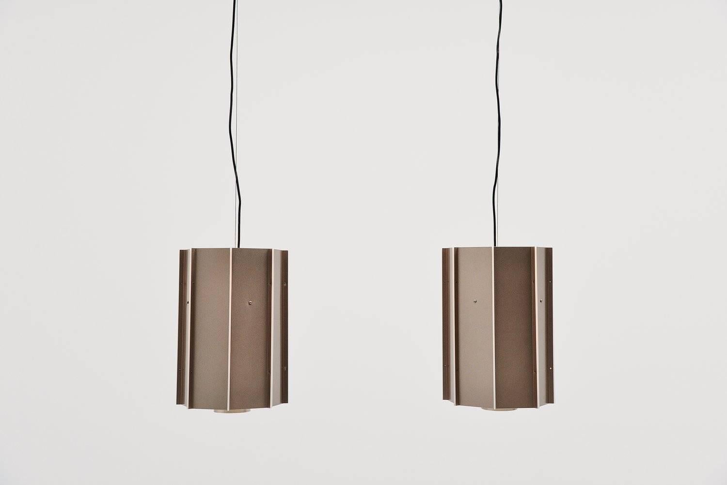 Large lot of ceiling lamps designed and made by RAAK, Amsterdam, 1970. These lamps have a copper color shade and between the layers there is plexiglas for a very nice light effect when lit. The lamps have a round diffuser at the bottom and uses one