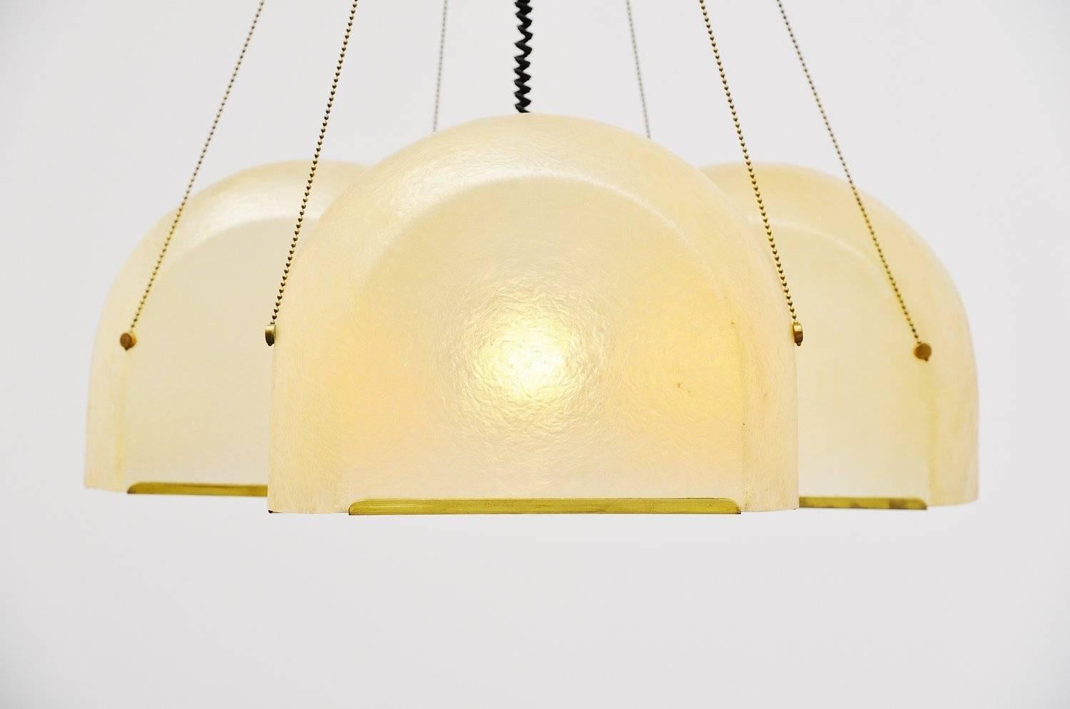 Very nice large fiberglass ceiling lamp designed by Salvatore Gregorietti for Lamperti, Italy, 1965. This rare hanging lamp has three semi transparent fiberglass shades with brass covered rims. There is a brass chain that holds the shades and brass