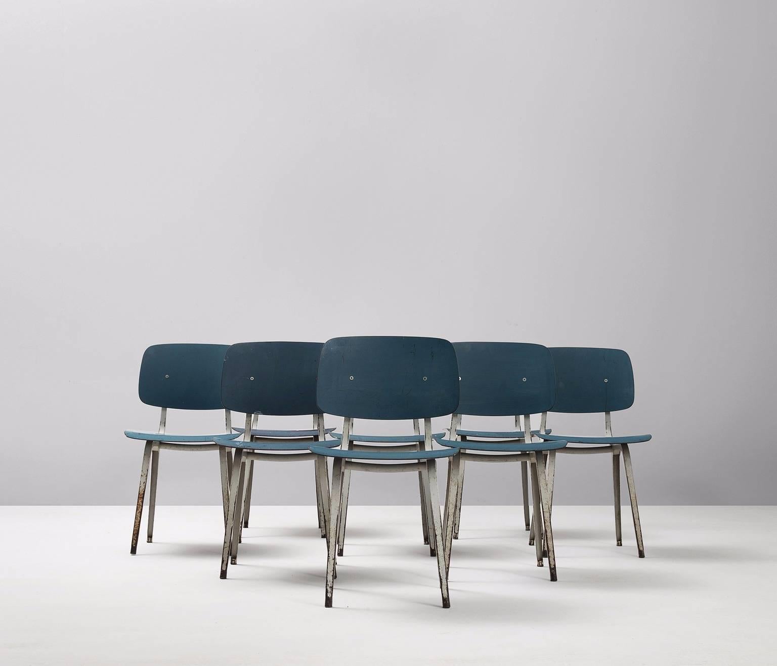Set of eight chairs, model Revolt, plywood and metal, by Friso Kramer for Ahrend De Cirkel, the Netherlands 1953. 

Eight blue lacquered Revolt chairs by Friso Kramer. The frame is made of profiled sheet metal, coated in light grey. The seat and
